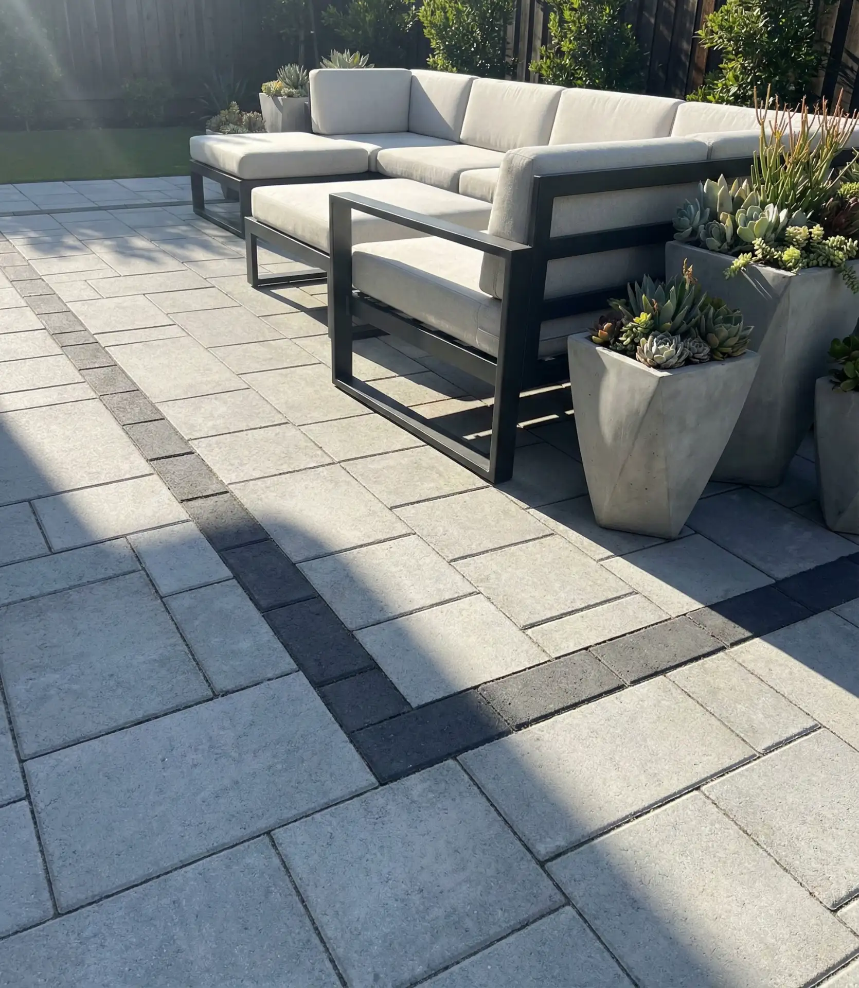 Geometric Paver Patio Design with Contrasting Borders 1