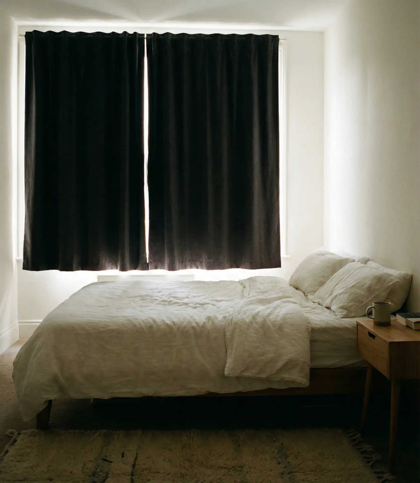 Bed Against Window with Blackout Curtains 2