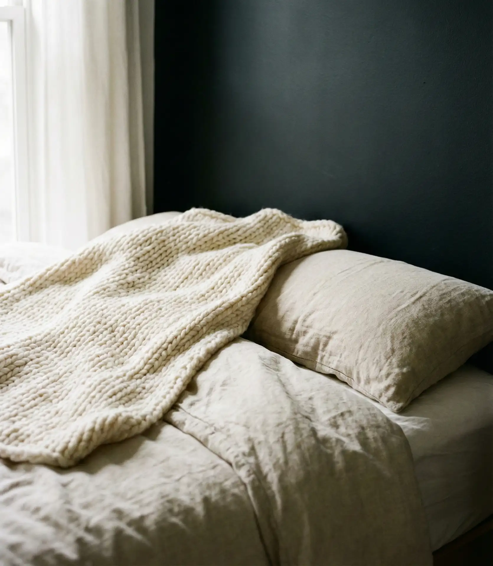 Black Accent Wall with Layered Neutral Textiles 2