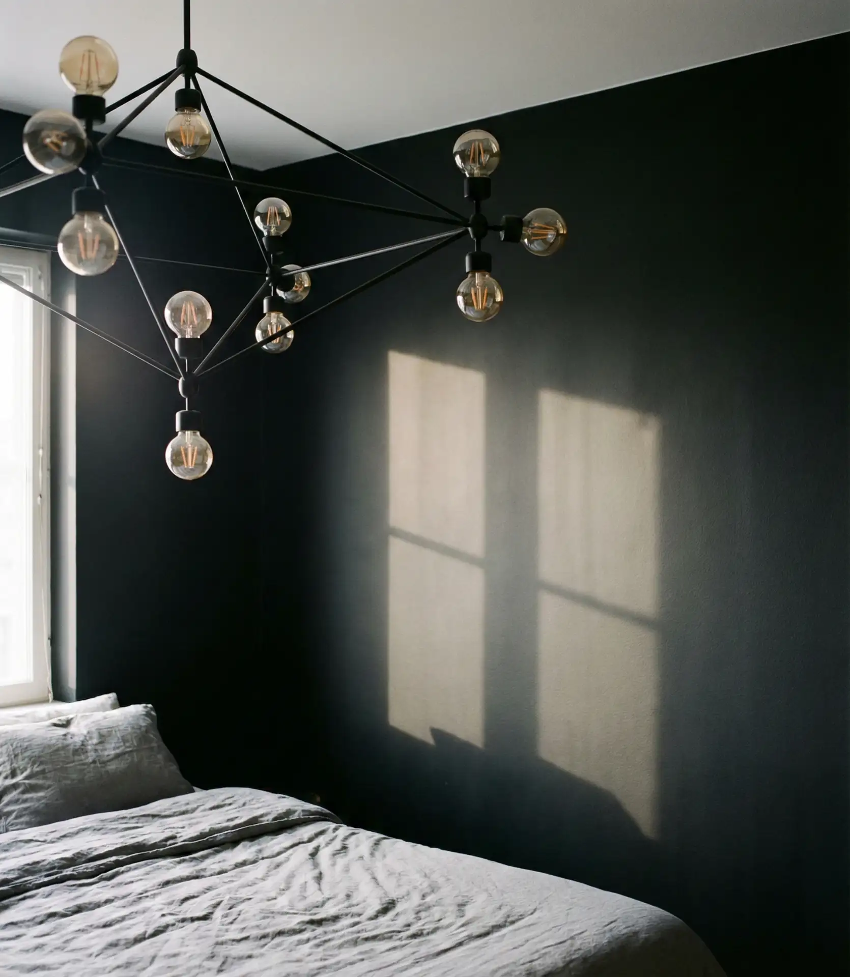 Black Accent Wall with Statement Lighting Fixture 2