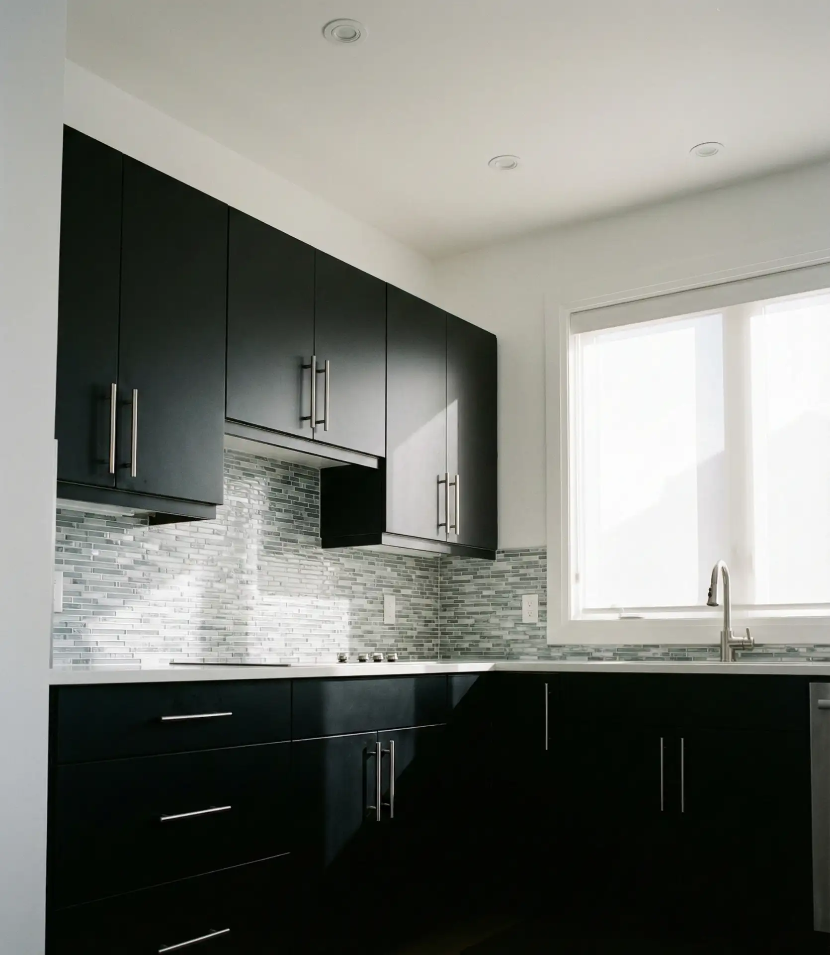 Black Cabinets with Chrome Hardware and Modern Lines 1