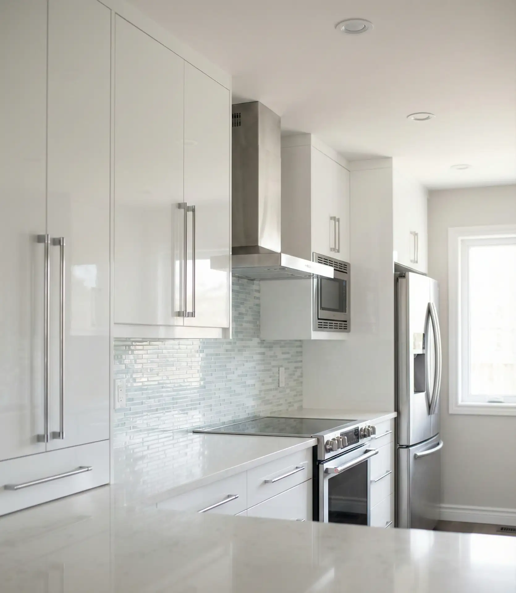 Glossy White Cabinets with Chrome Details 2