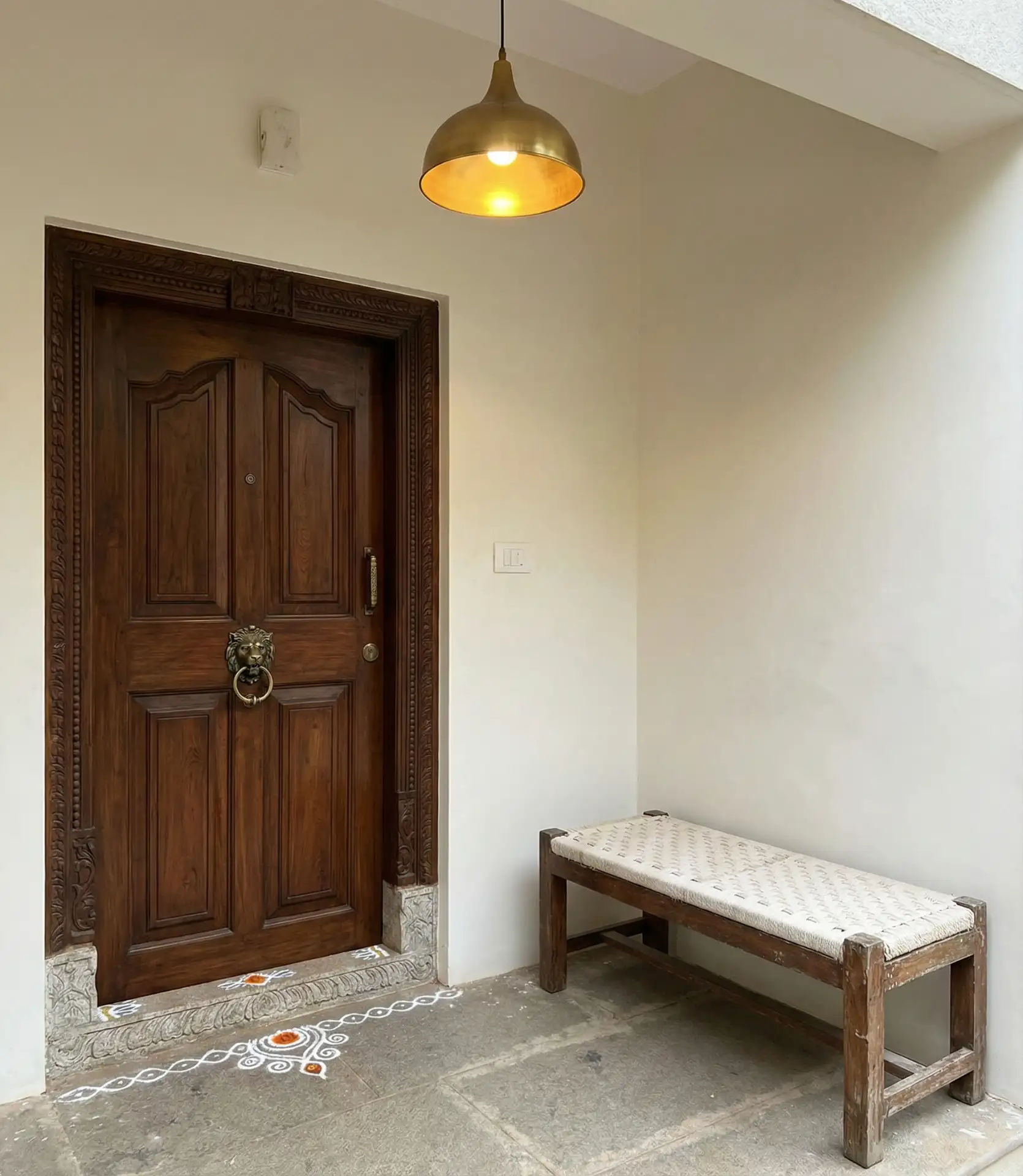 Indian Story-Style Entryway with Carved-Wooden Door 1