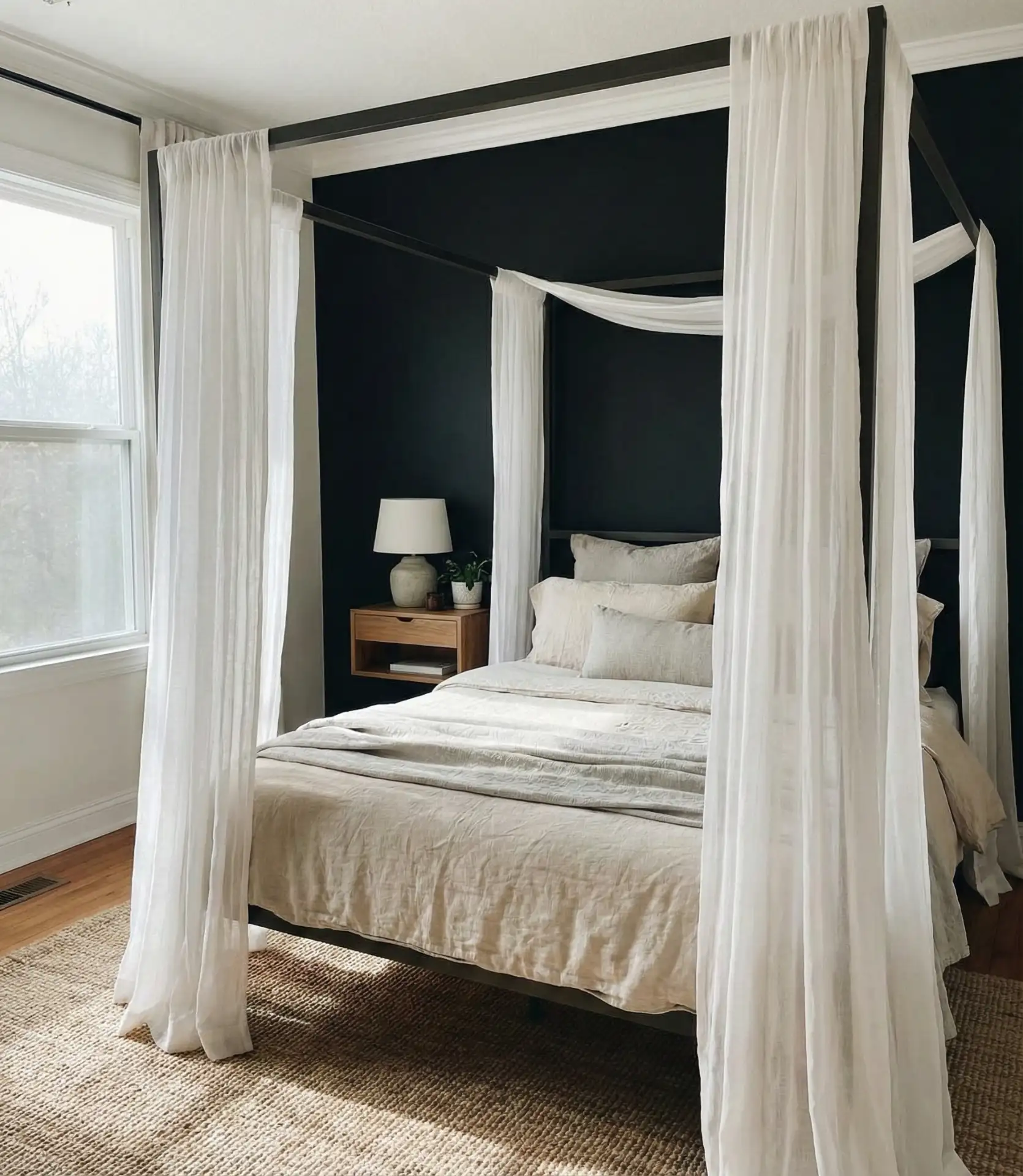 Matte Black Wall Behind a Canopy Bed 1