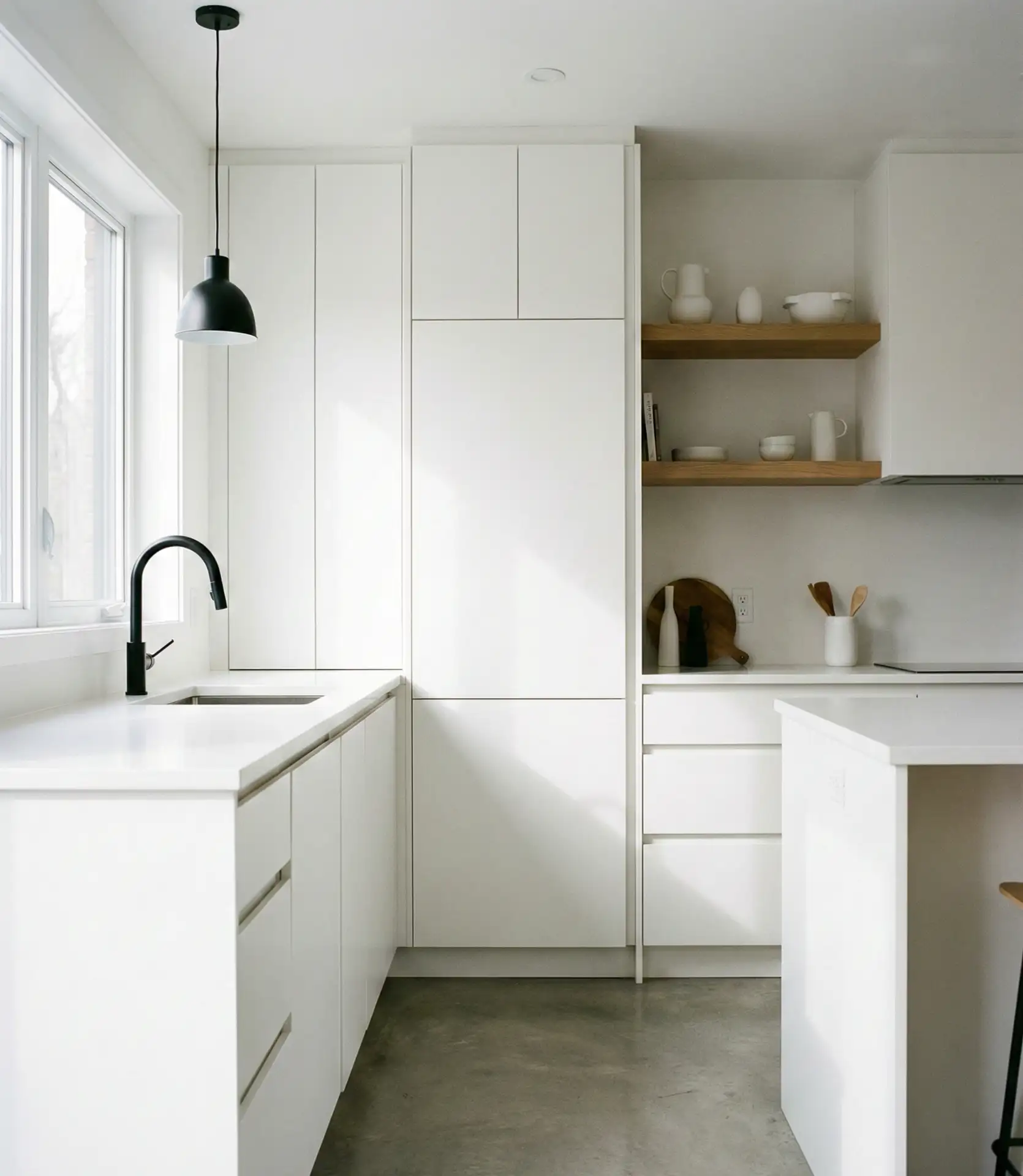 Minimalist White Kitchen with Black Accents 1