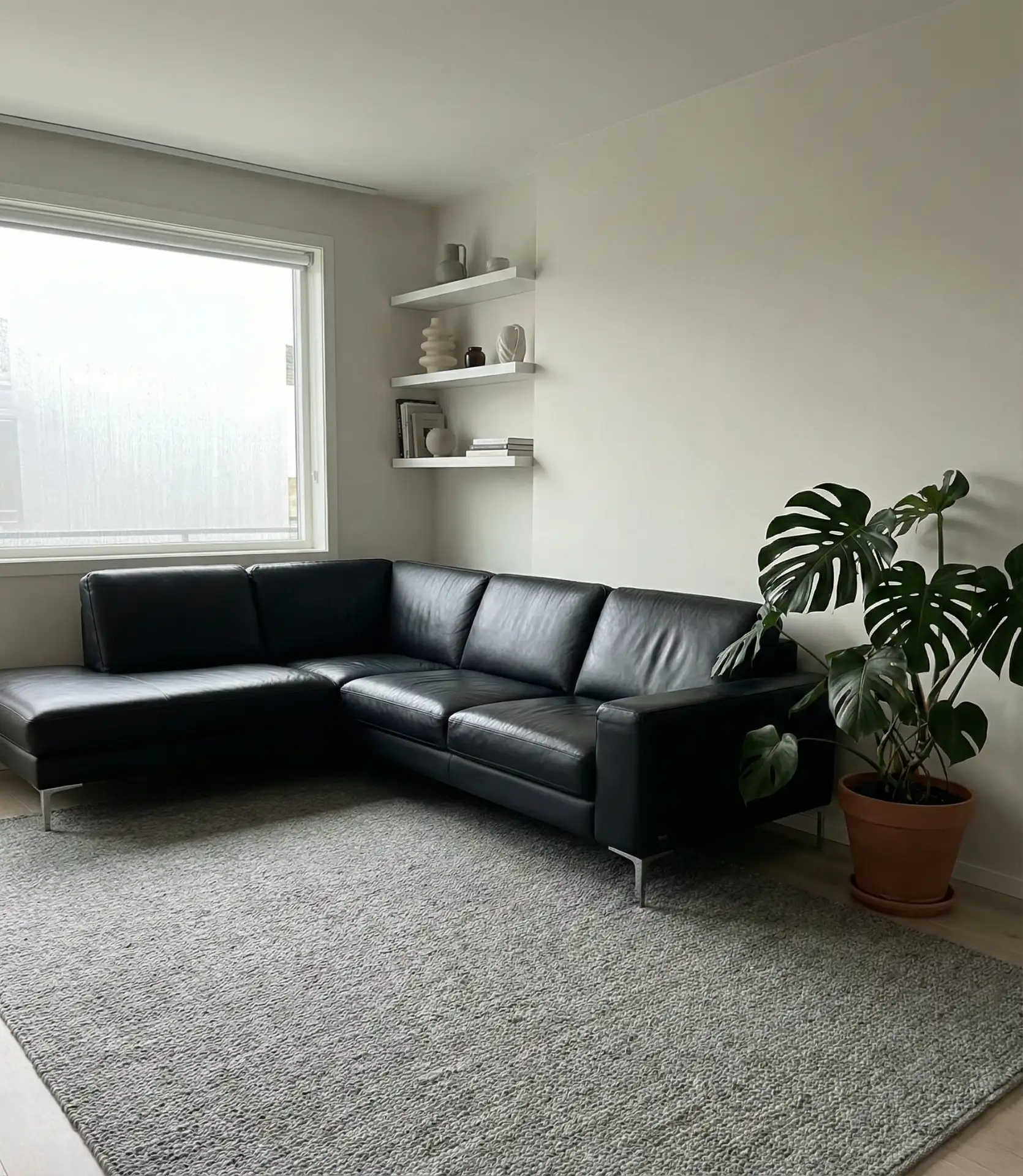 Modern Black Leather Sectional in Minimalist Space 1