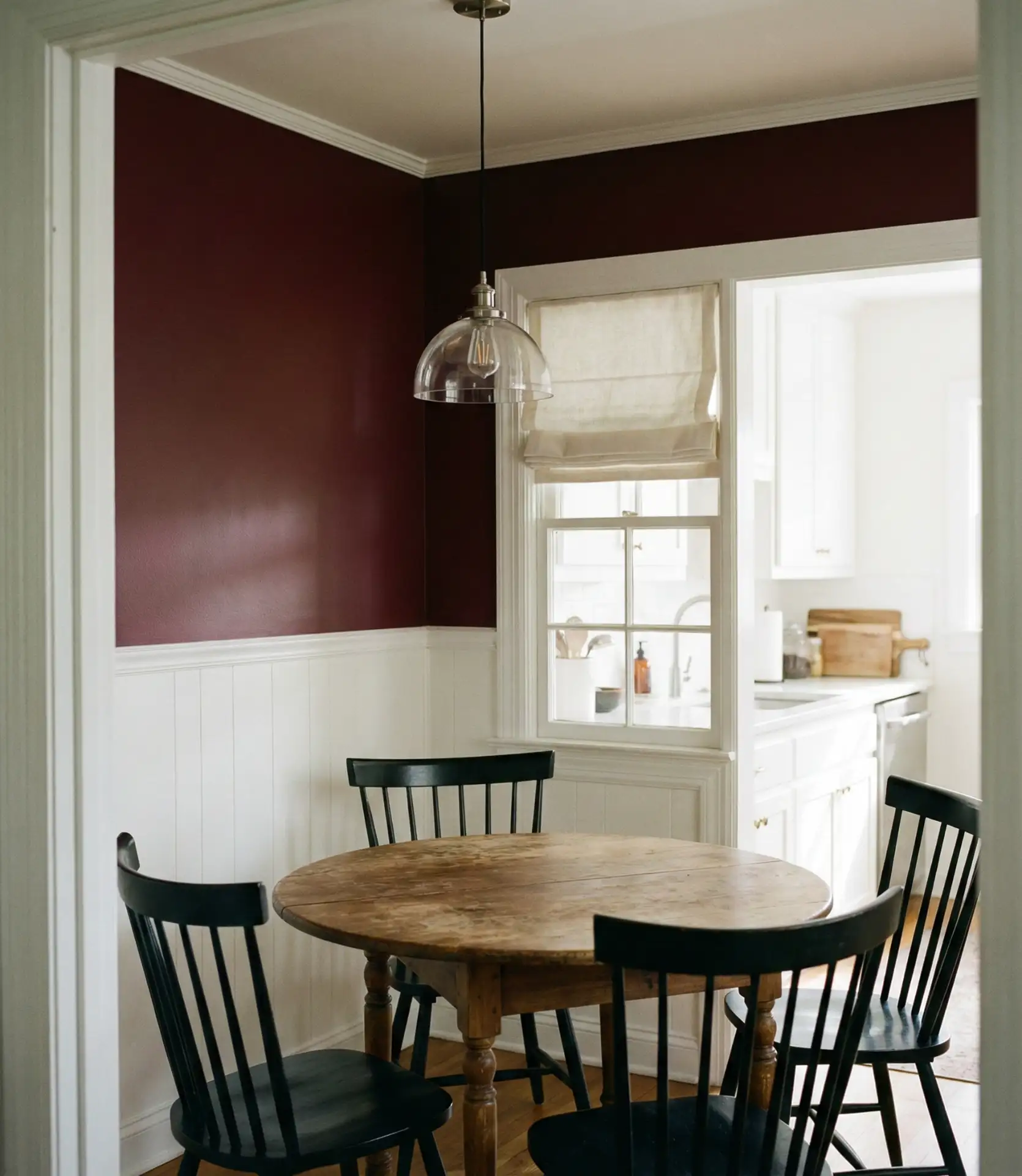 Rich Burgundy Accent Wall Behind Breakfast Nook 1