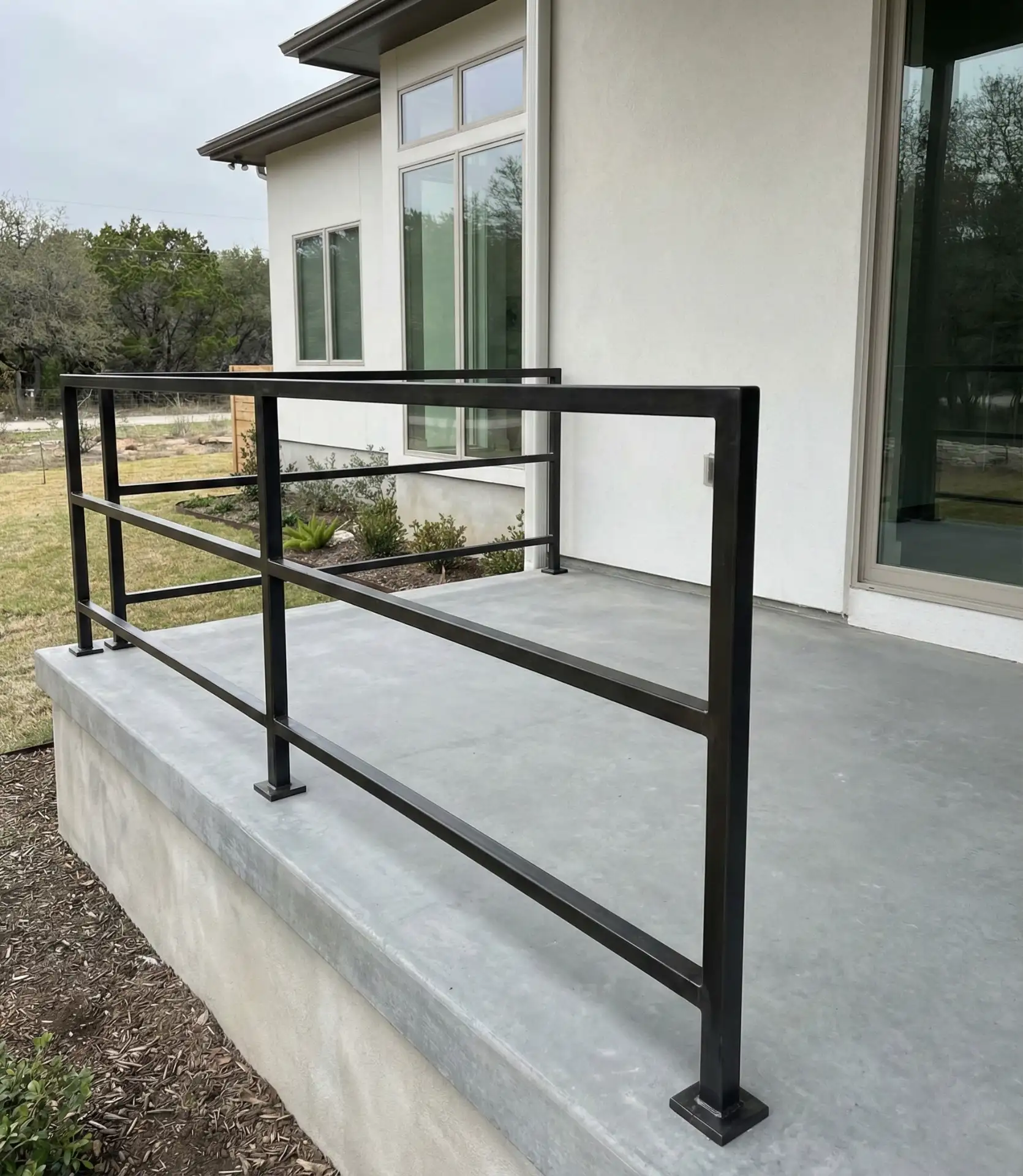 Simple Two-Rail Design on Concrete Porch 1