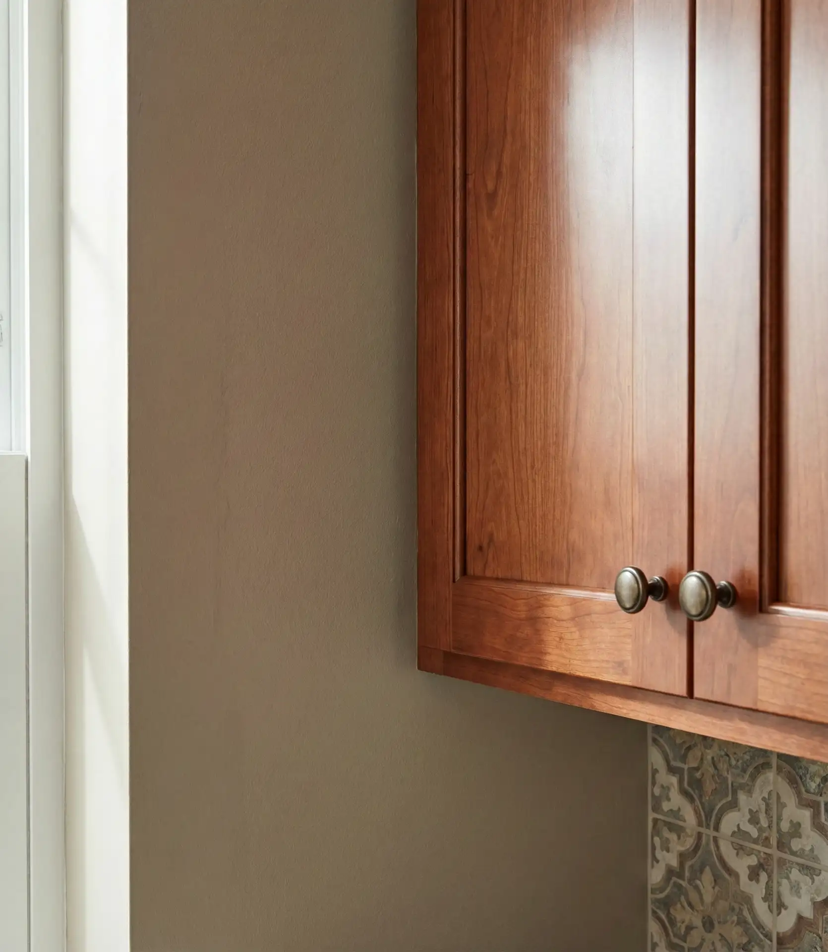 Taupe Walls with Cherry or Mahogany Wood Cabinets 1