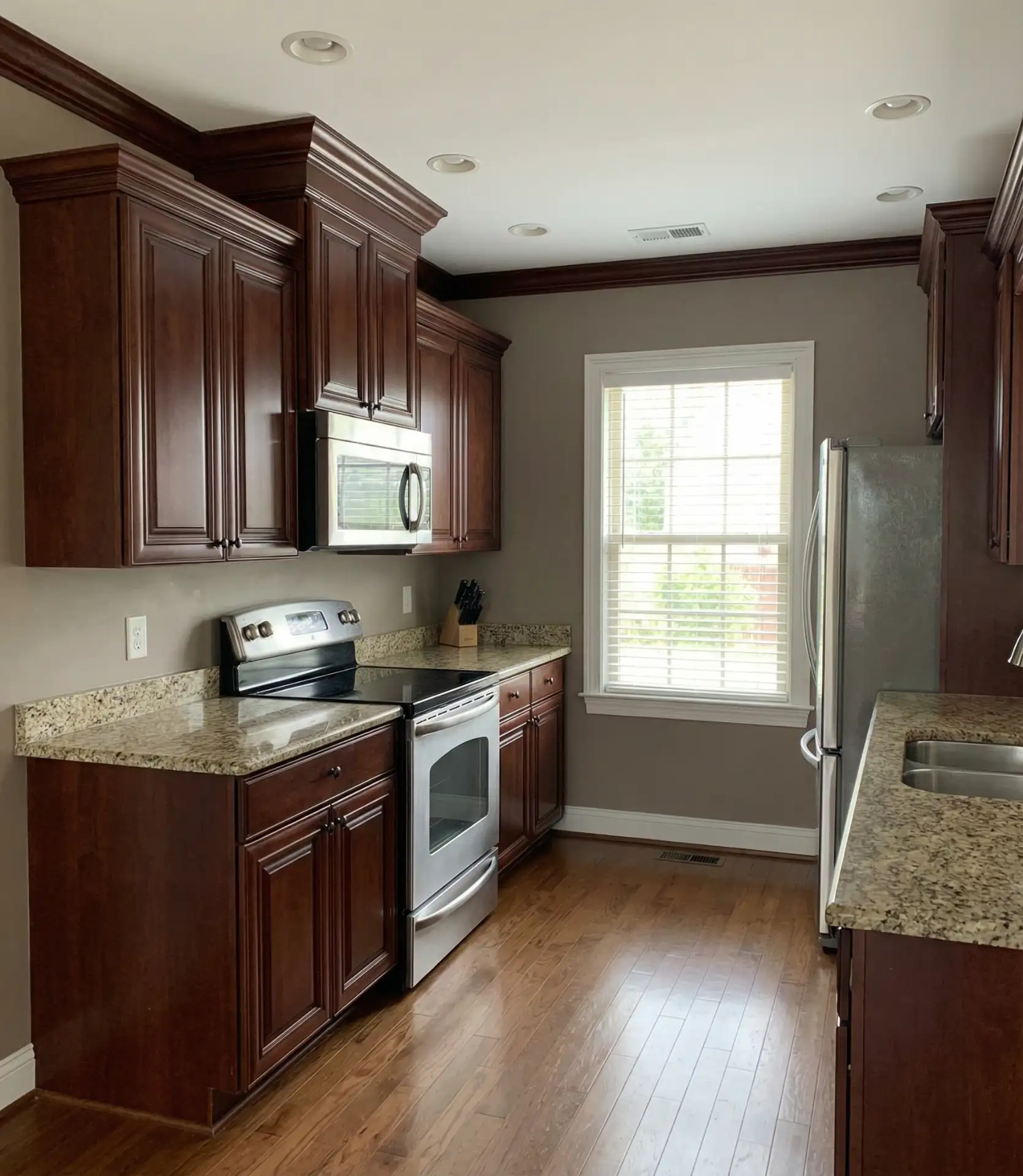 Taupe Walls with Cherry or Mahogany Wood Cabinets 2