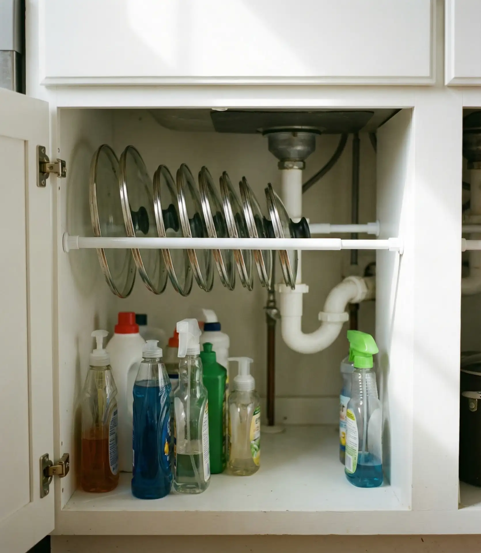 Tension Rod Lid Storage Under Sinks 1