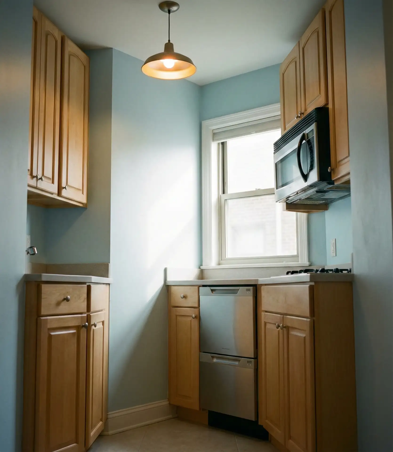 Tiny Galley Kitchen with Space-Saving Appliances 1