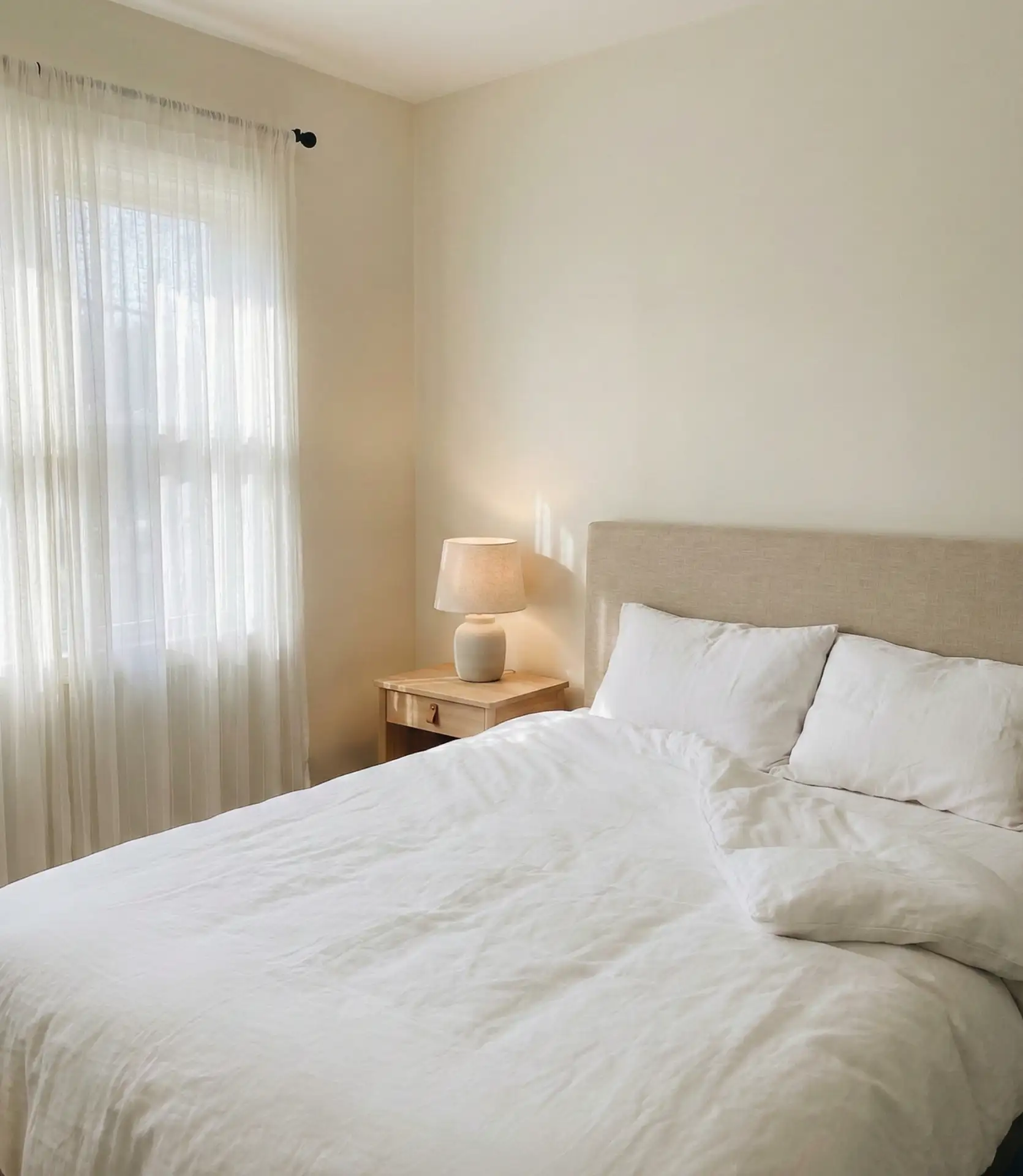 Warm White Walls with a Beige Headboard 1