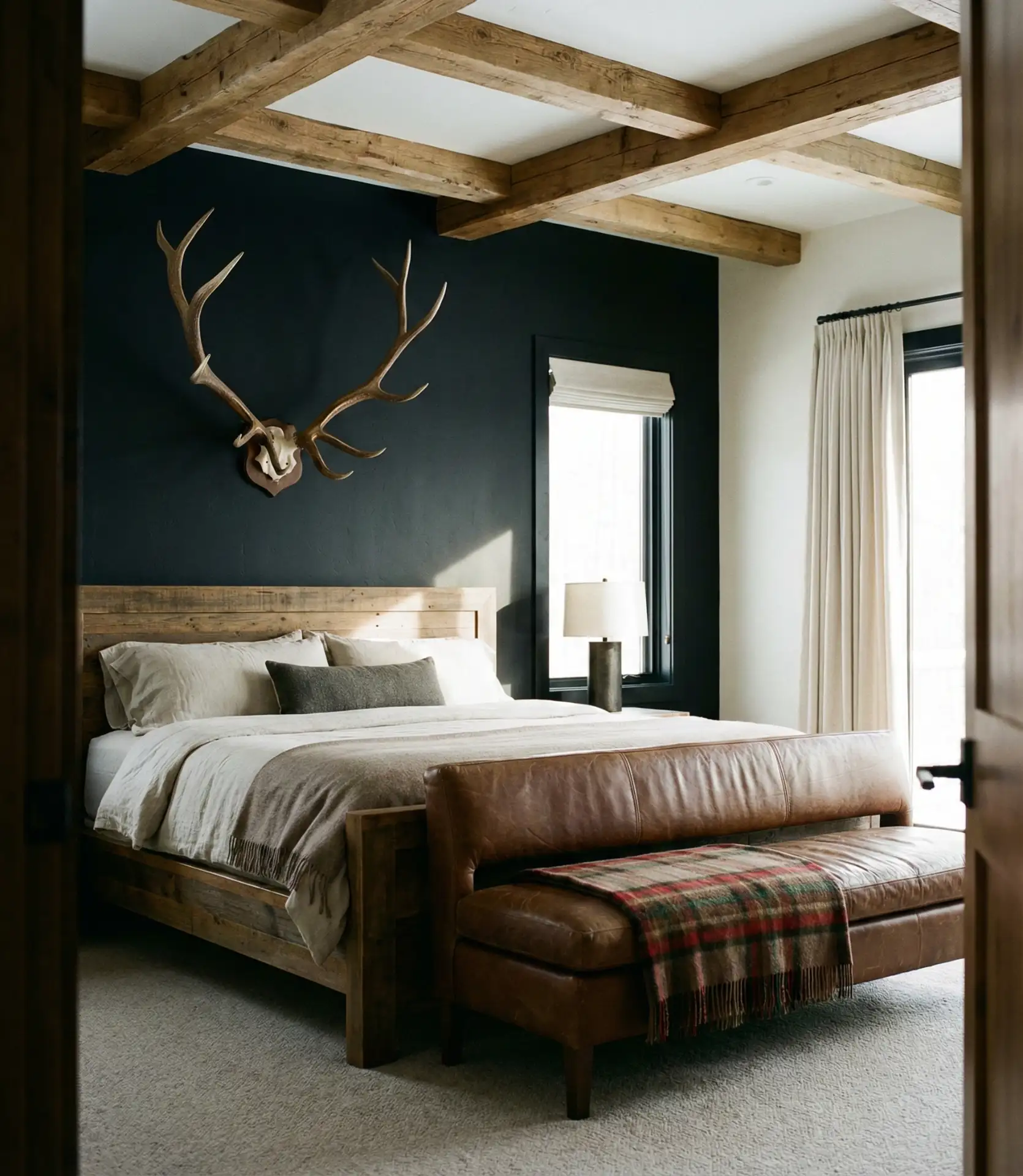 Western-Inspired Black Accent Wall with Leather and Cowhide 1