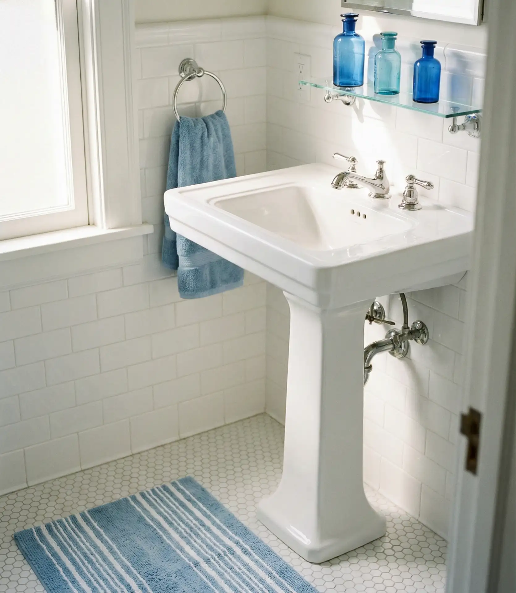 White Bathroom with Blue Accessories 2