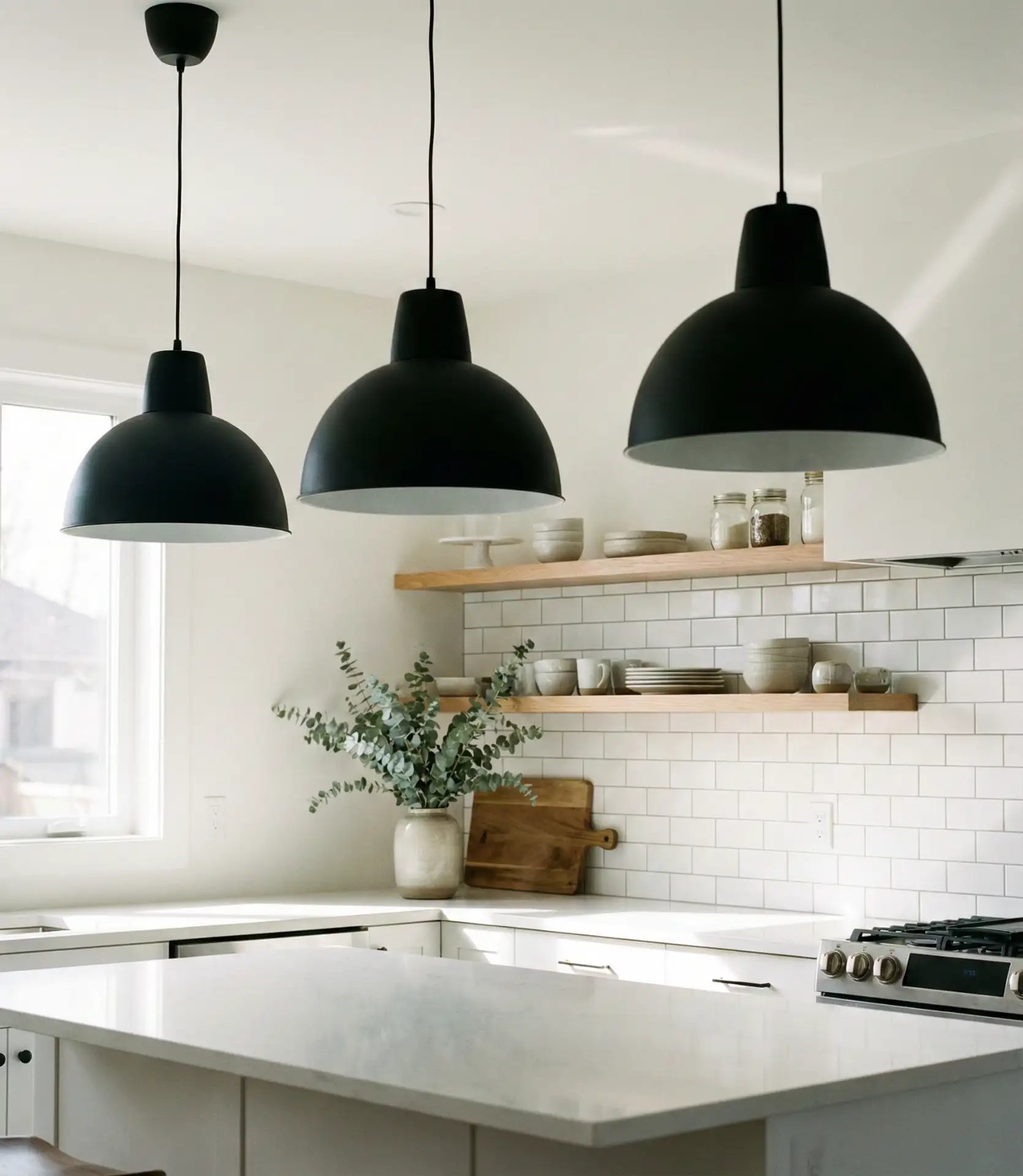 White Kitchen with Black Pendant Lights 2