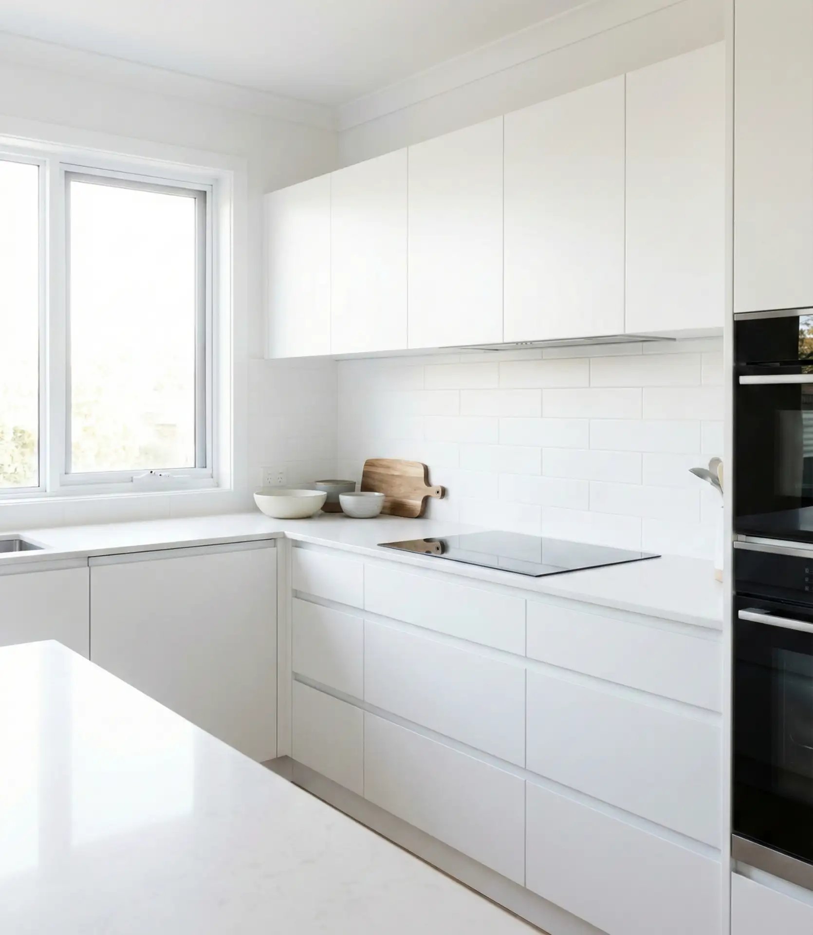 White Minimalist Kitchen with Handleless Cabinets 1