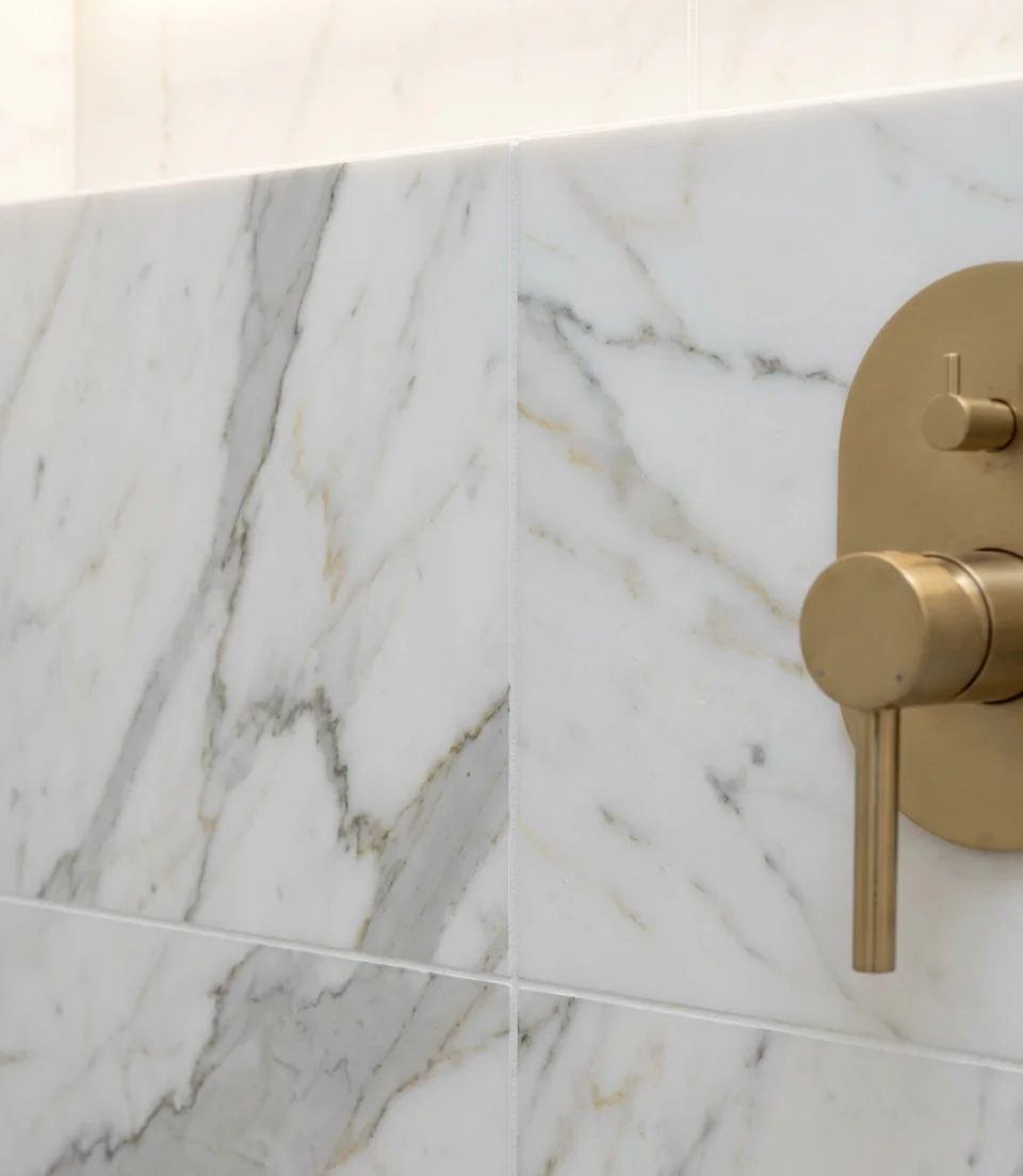 White Marble-Look Tile with Gold Accents 2