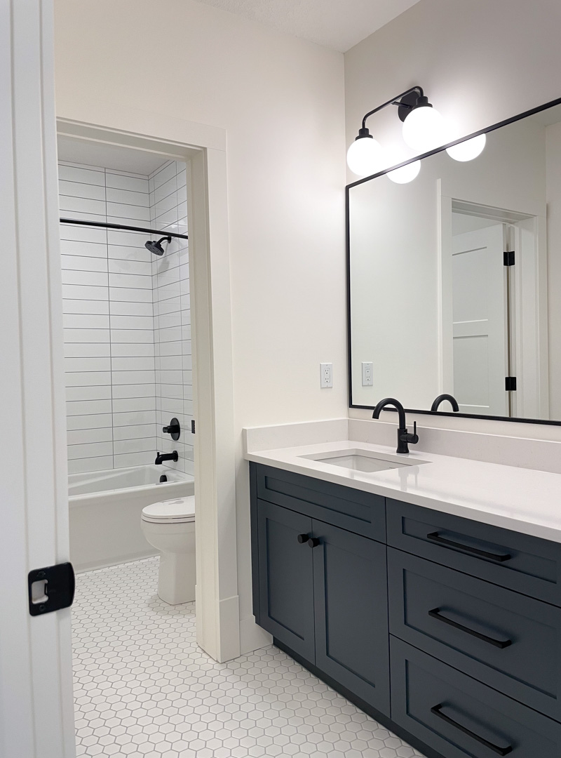 Black Double Sconces in Our Basement Bathroom (Sources + Design Tips) - Satori Design for Living