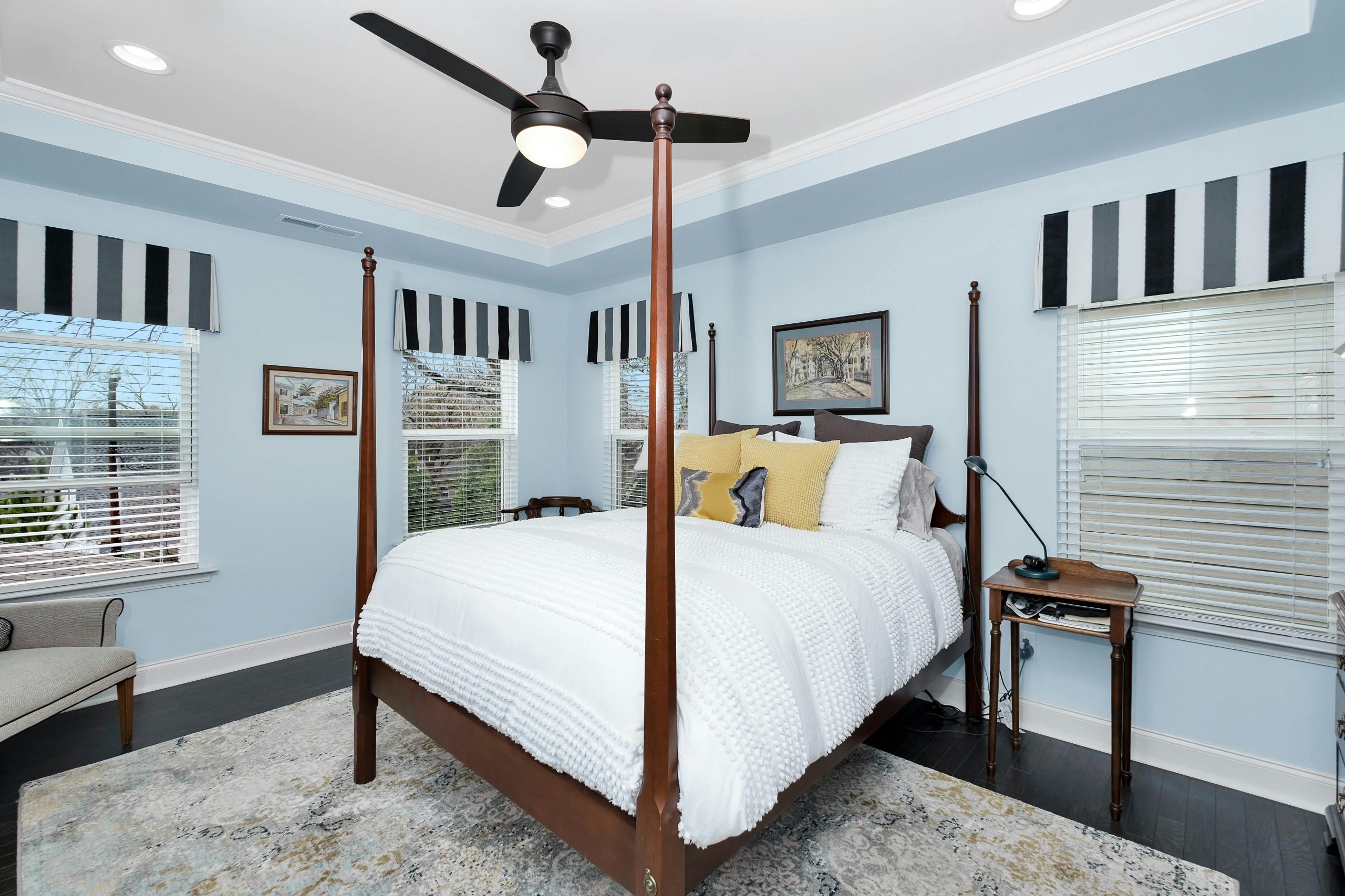 a bedroom with a bed and a lamp