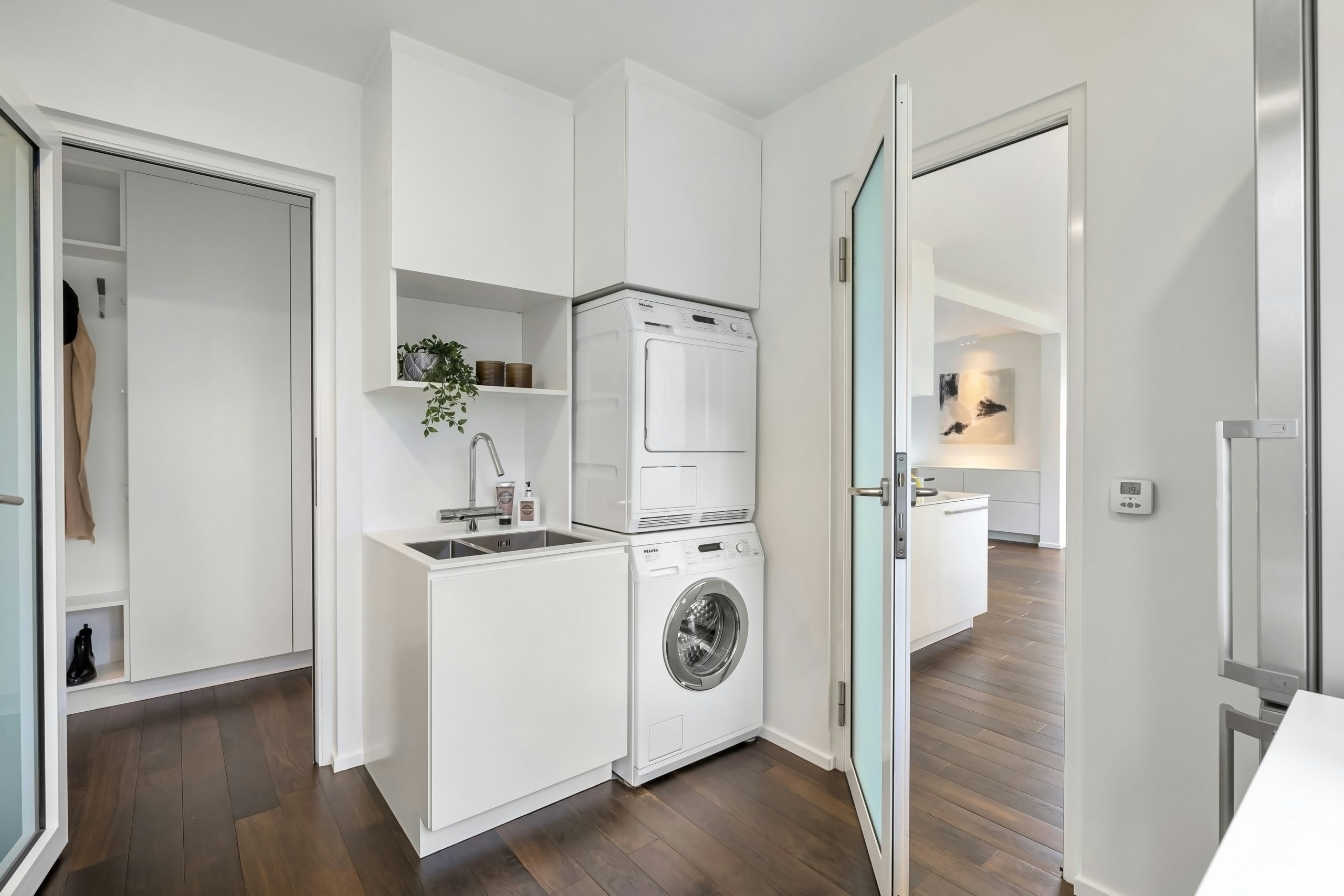 A laundry room with a washer and dryer