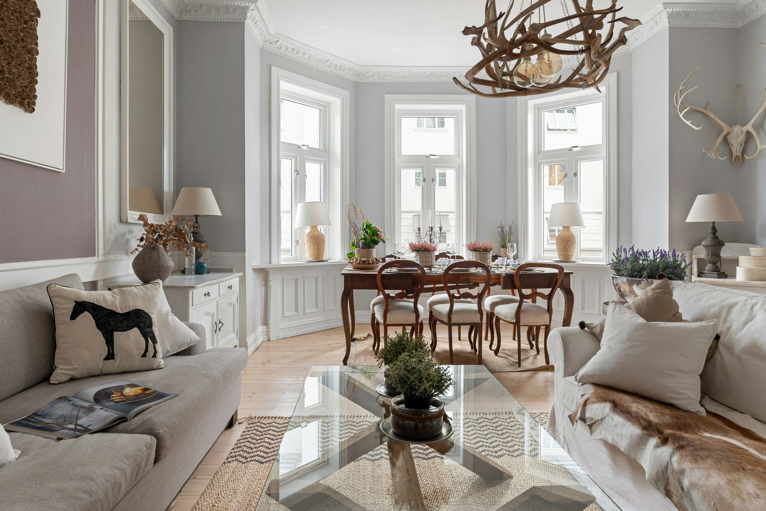 A living room filled with furniture and a chandelier