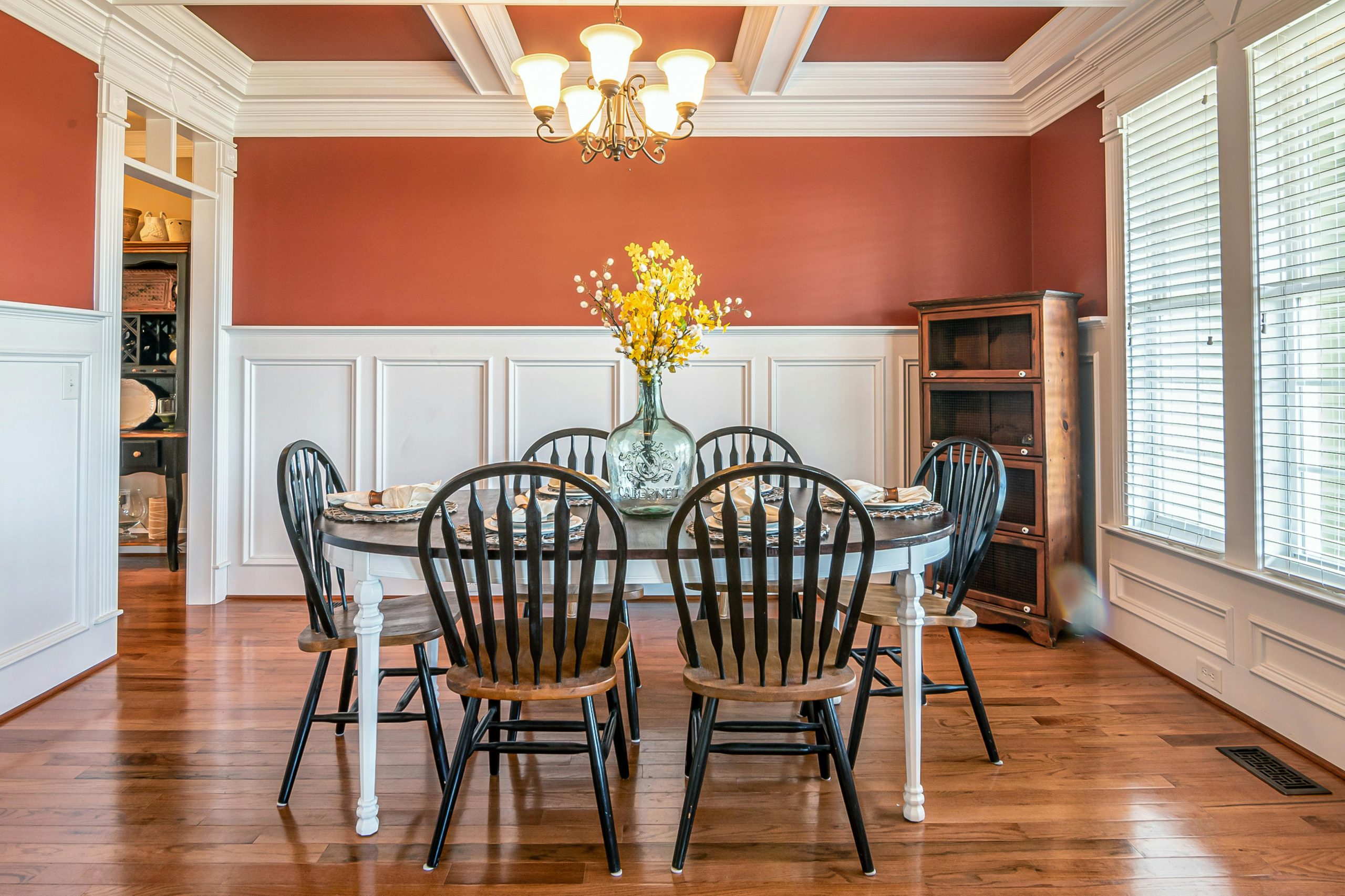 Bright and sophisticated dining room featuring a round table and elegant decor.