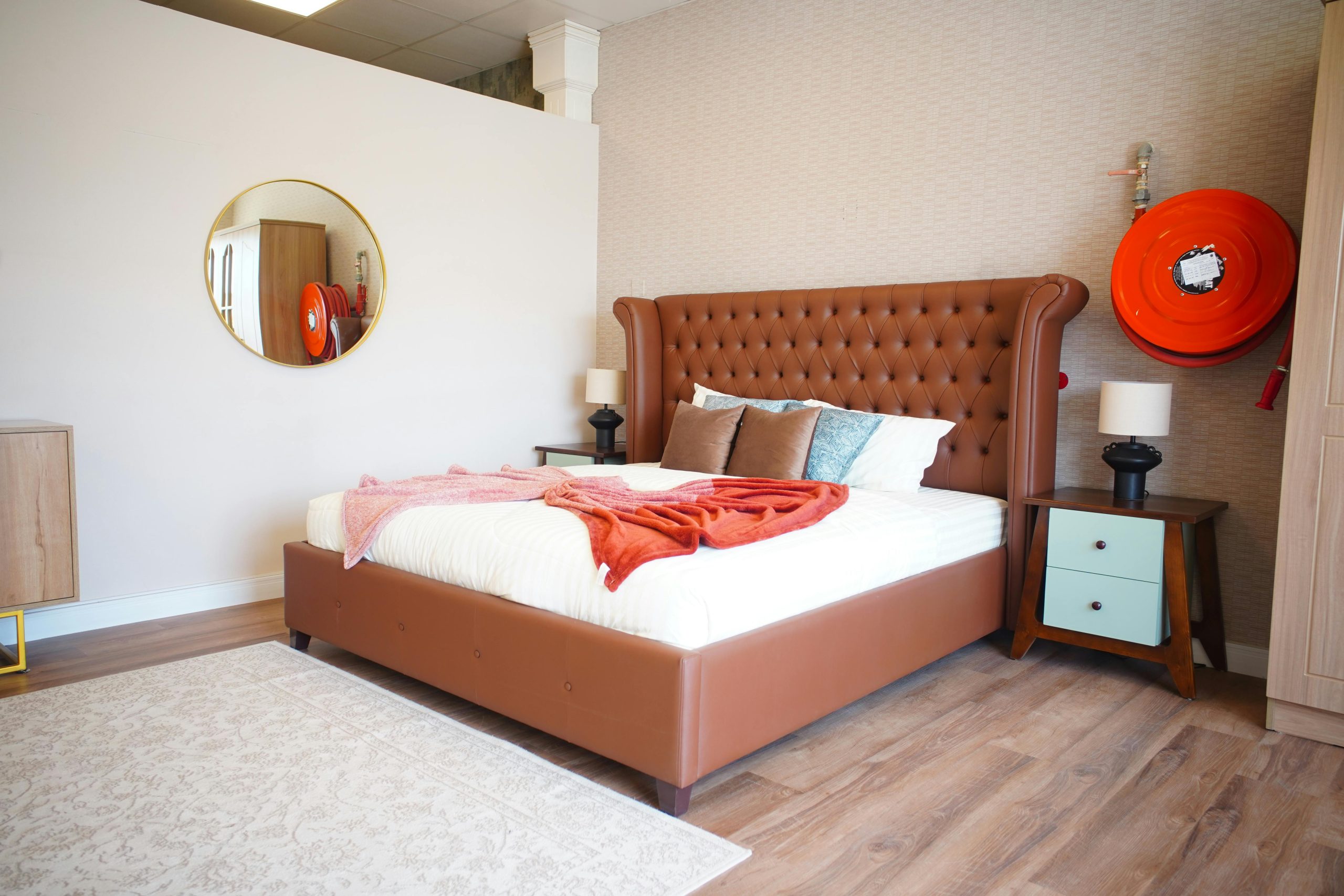 Explore a modern bedroom with luxurious decor, featuring a tufted headboard and stylish accents.