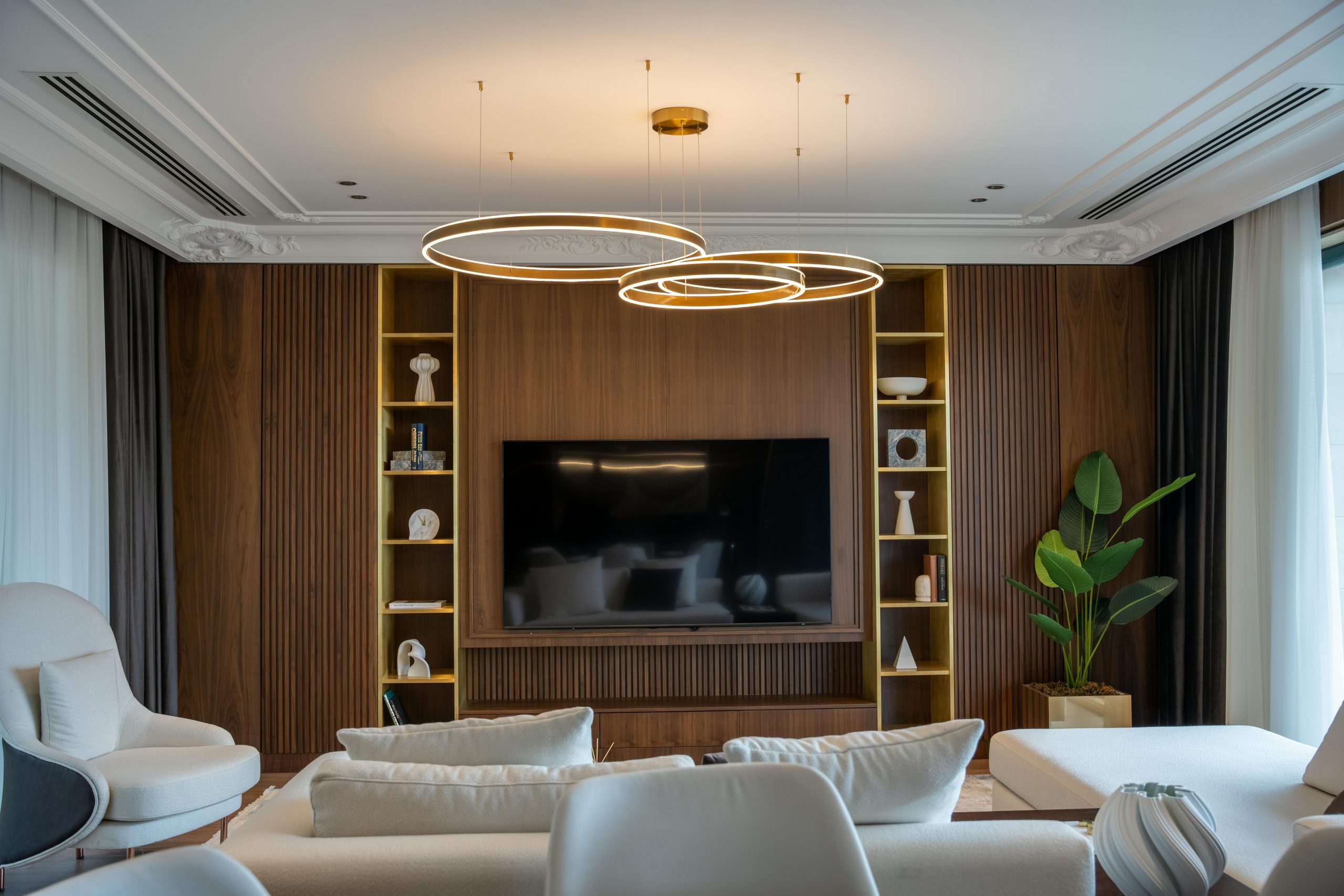 Sophisticated living room featuring contemporary furniture and unique lighting for a luxurious feel.