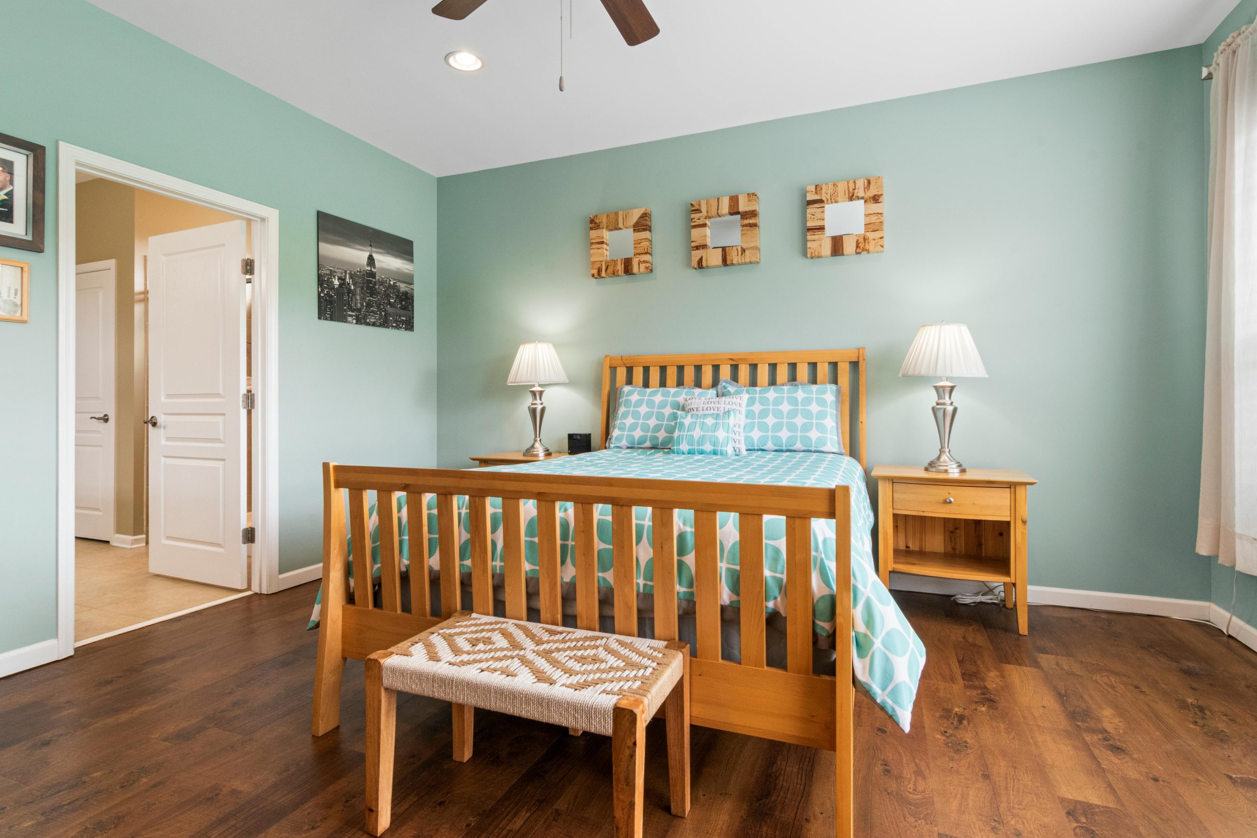 Warm and cozy bedroom featuring wooden furniture and modern decor elements.
