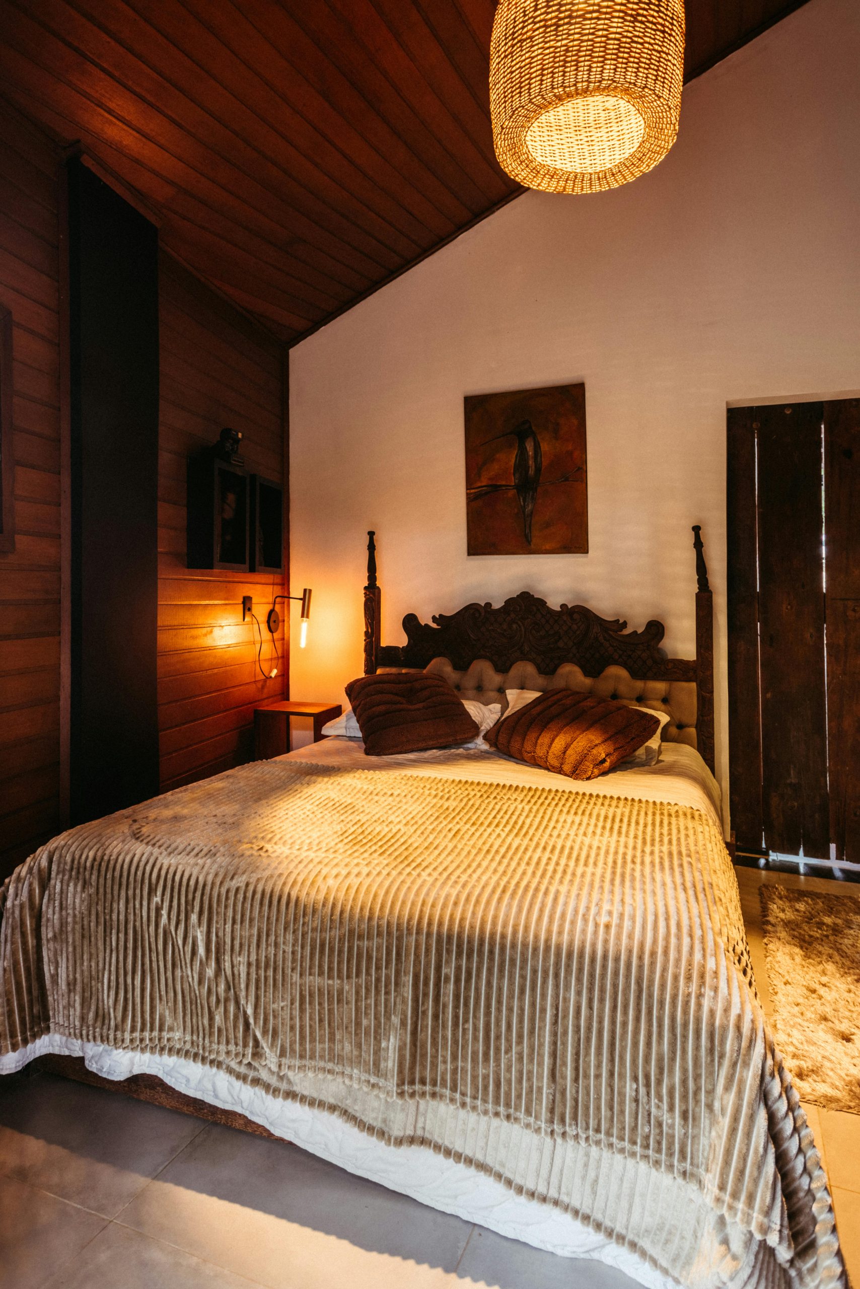Warm and inviting bedroom in a wooden cabin, Santa Teresa, Espírito Santo, Brazil.