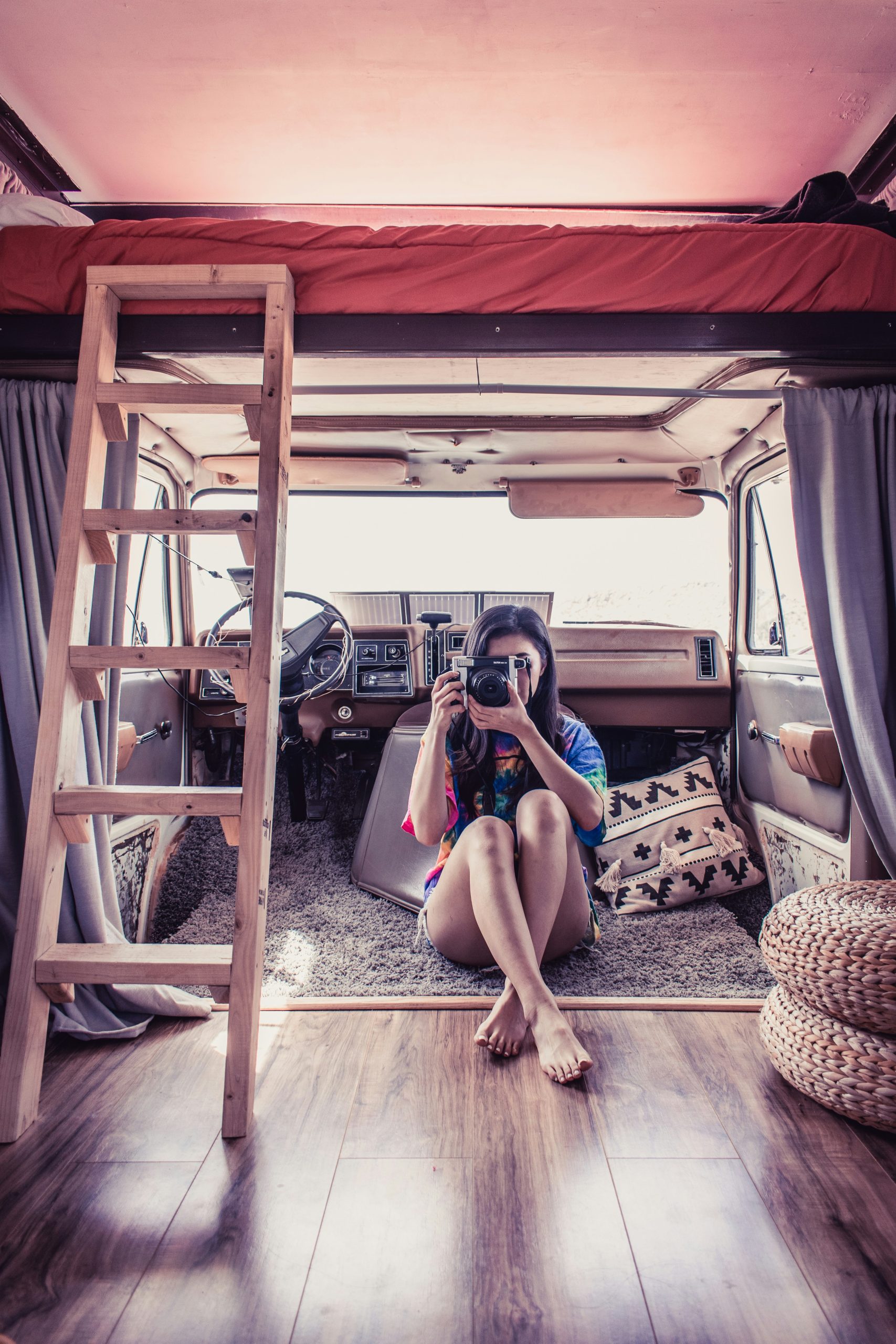 A vintage portrait under the desert sun with a view inside of the Gemini van (AirBnB rentable).
