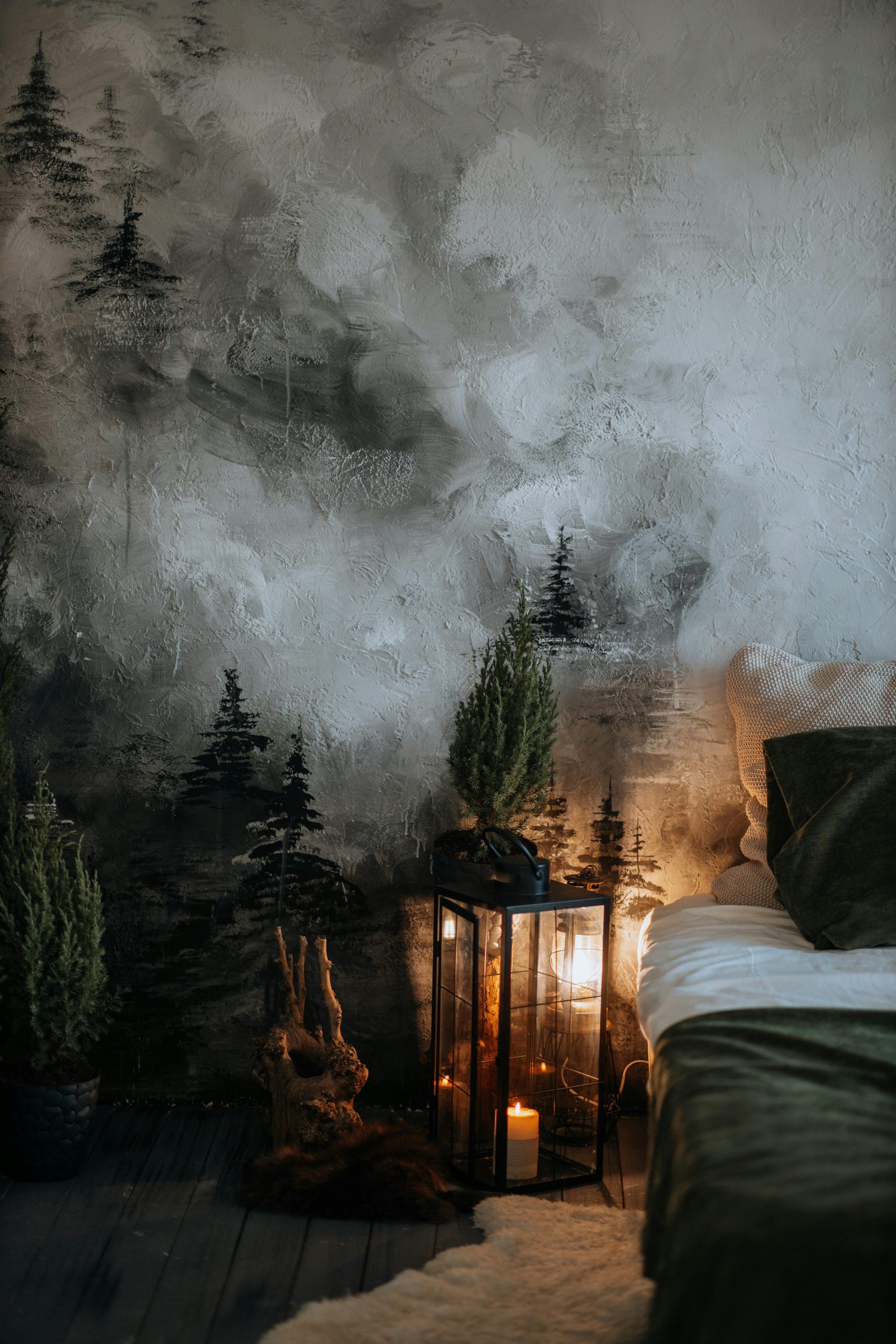 Atmospheric bedroom scene featuring candlelight and artistic wall decor for a cozy winter ambiance.