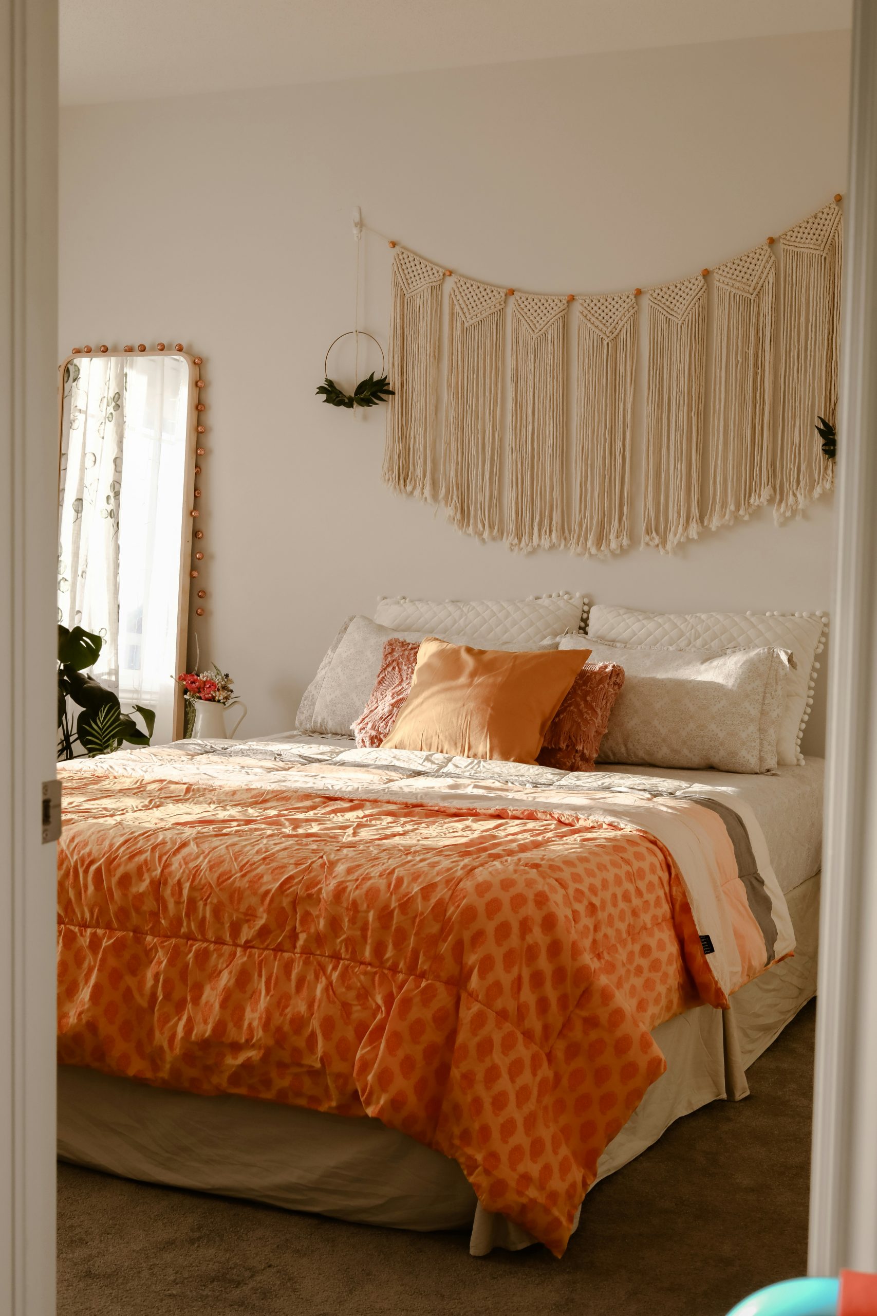 Boho bedroom with sunlight and yellow duvet