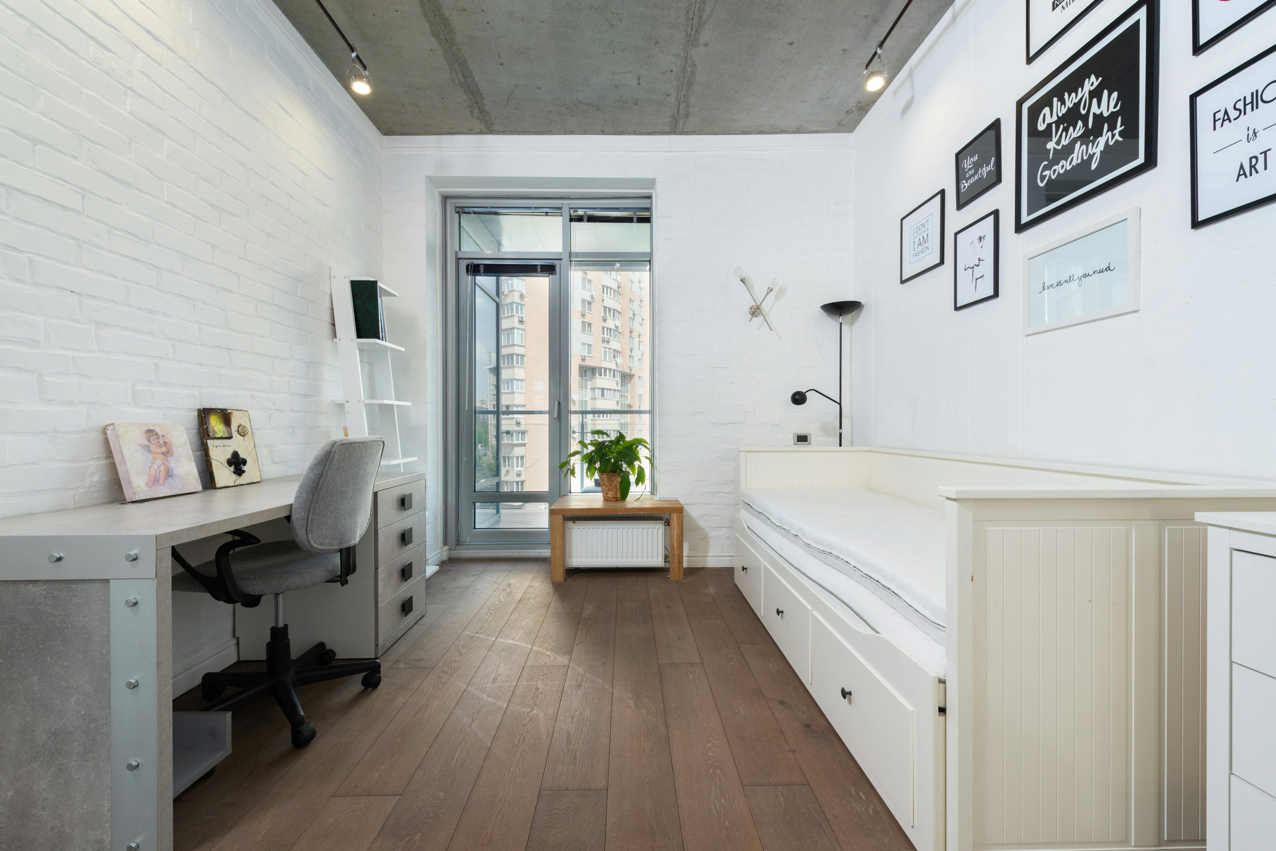 Bright, minimalist bedroom with contemporary decor and stylish furnishings.