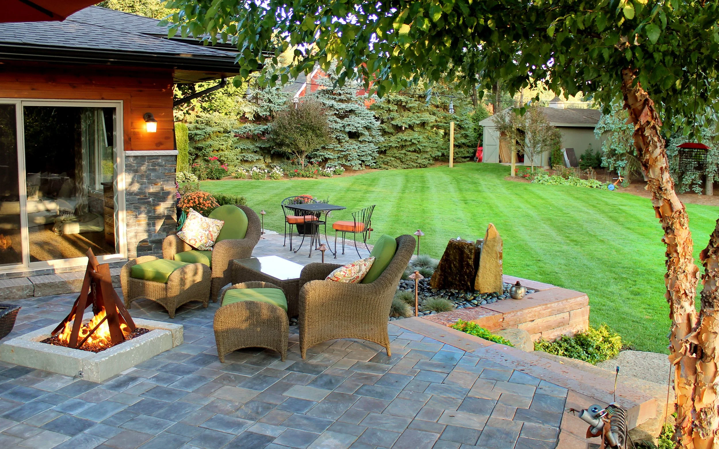 Creating Cozy Outdoor Spaces: Plantings and Fire Pit Ideas for Brighton and South Lyon, MI