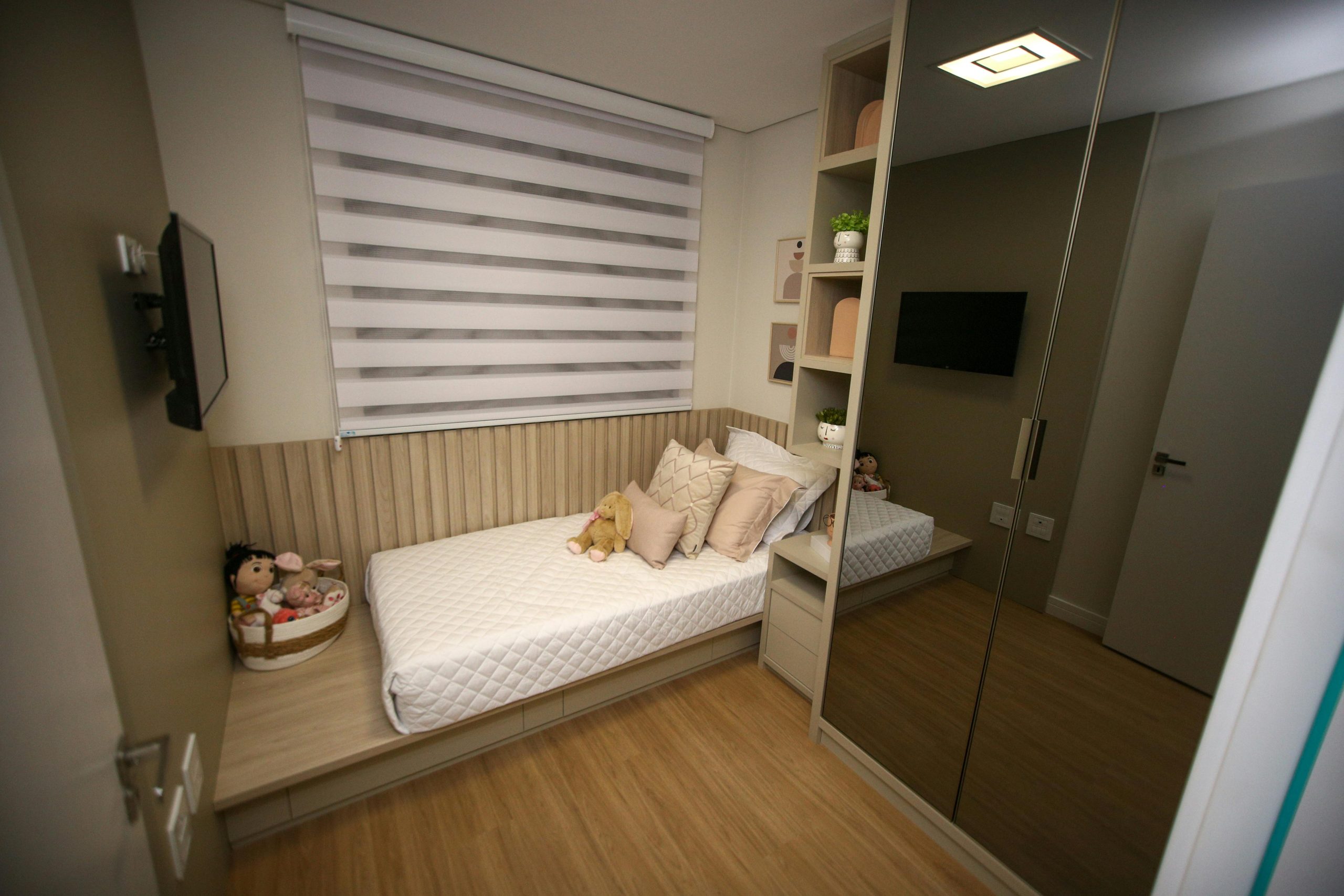 Elegant children's bedroom with cozy decor, soft lighting, and stylish furnishings.