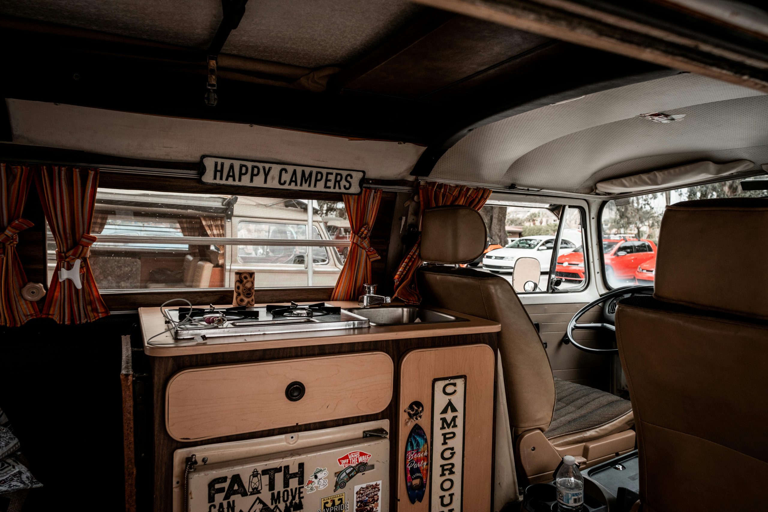 Explore the nostalgic interior of a vintage Volkswagen camper van equipped for adventure.