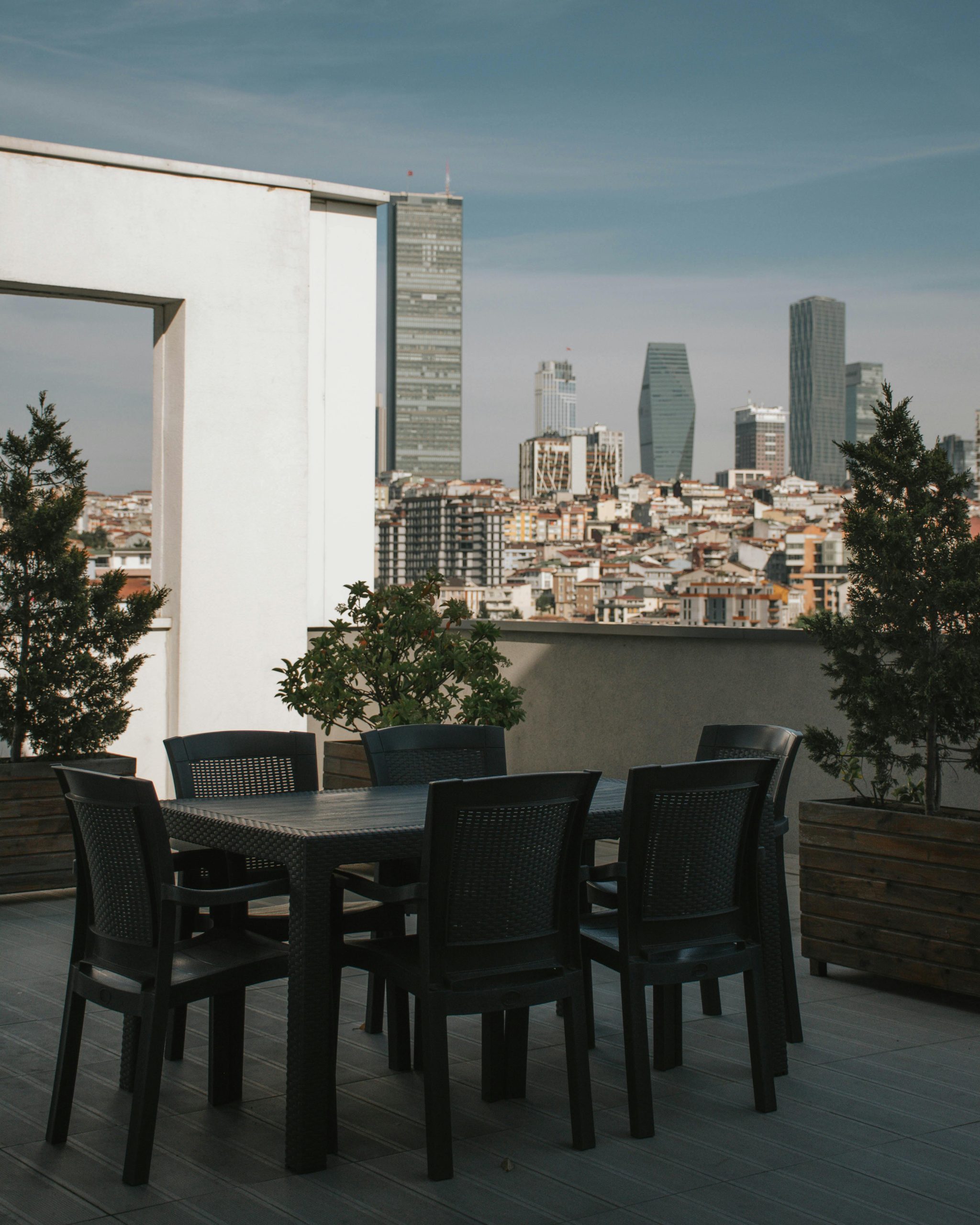 Stylish rooftop terrace offering a stunning view of Istanbul's modern cityscape.