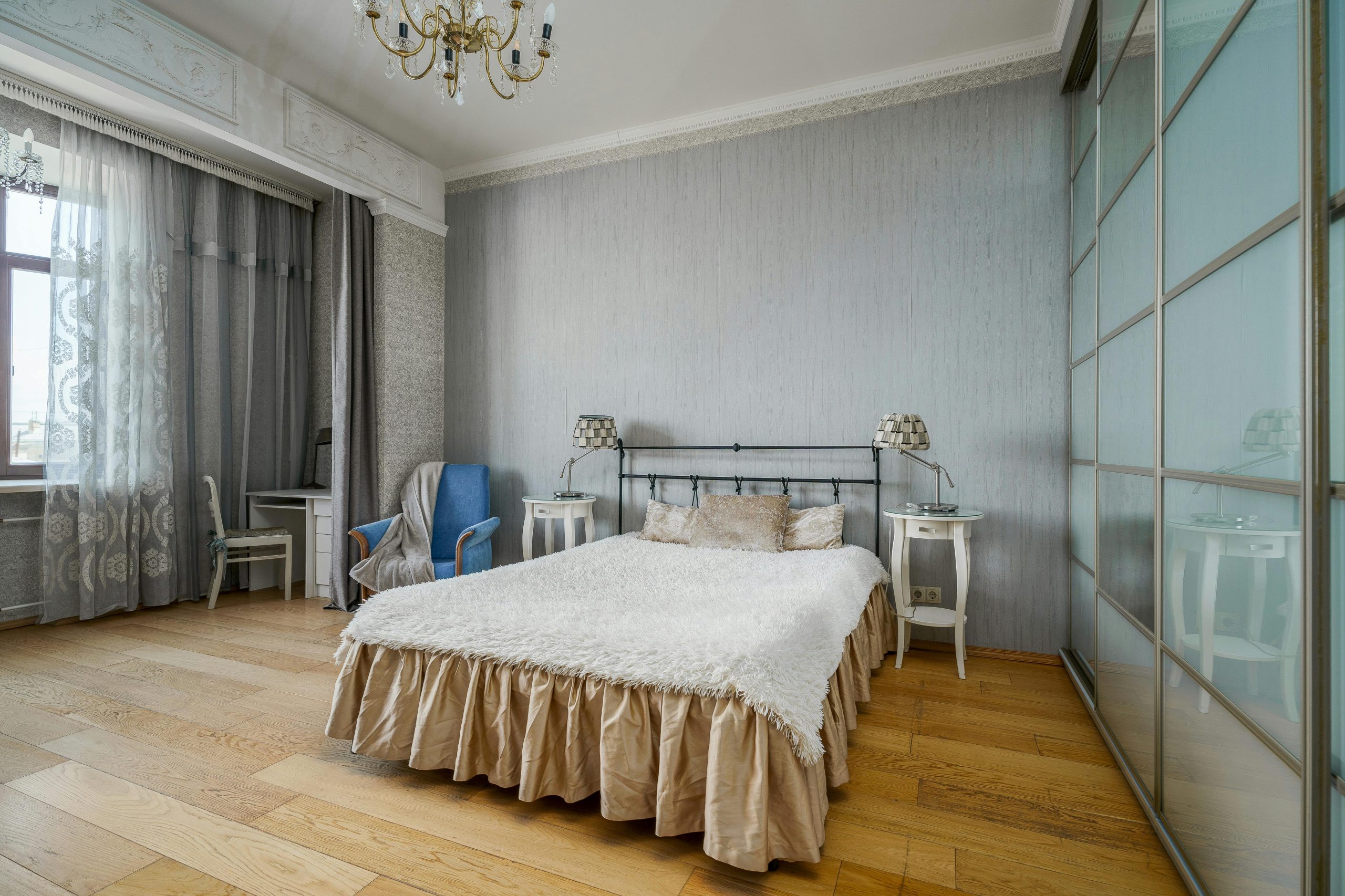 Stylishly furnished bedroom with modern decor and elegant lighting.
