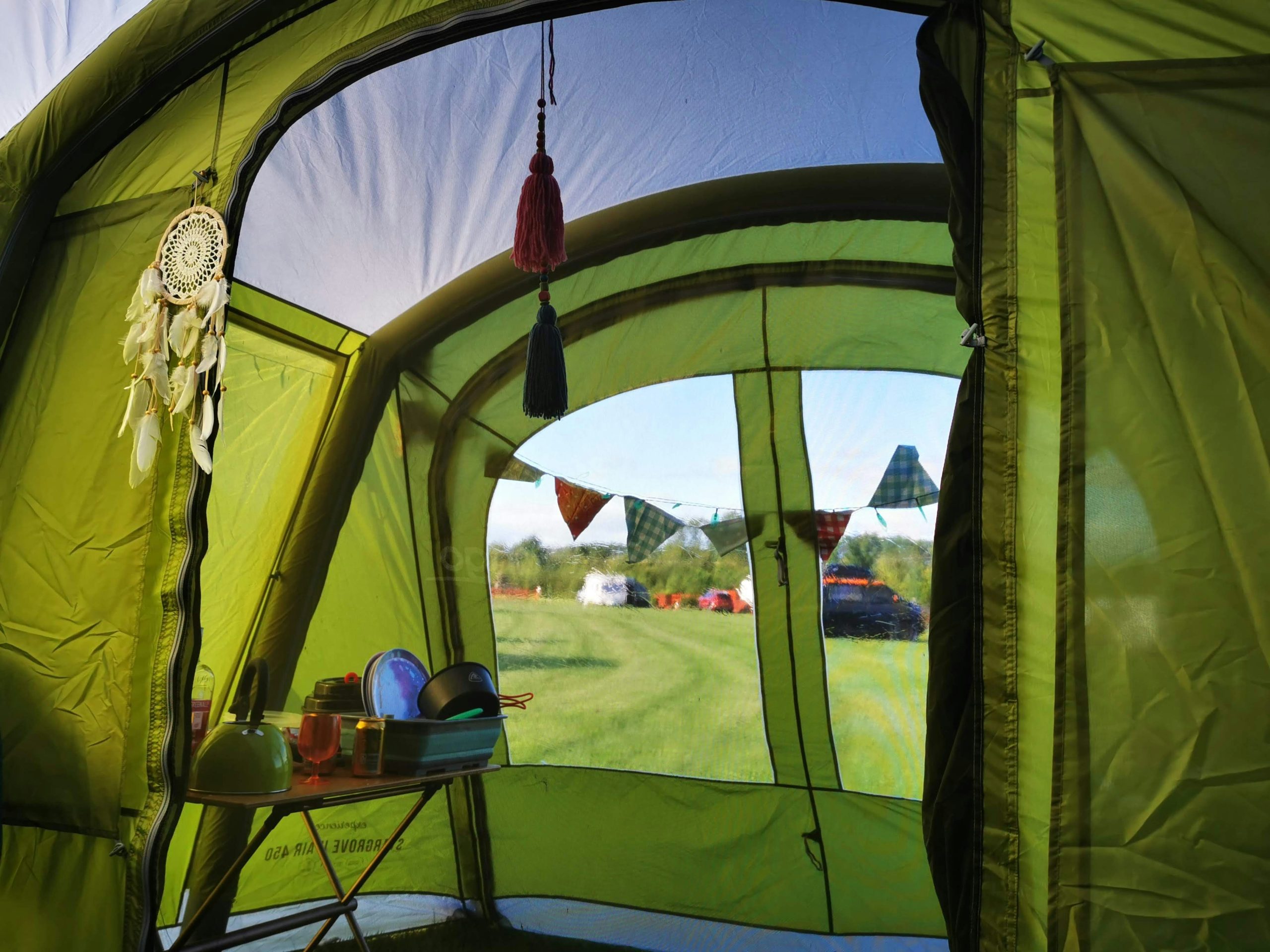 The inside of an airbeam inflatable family camping tent pitched on an English campsite
