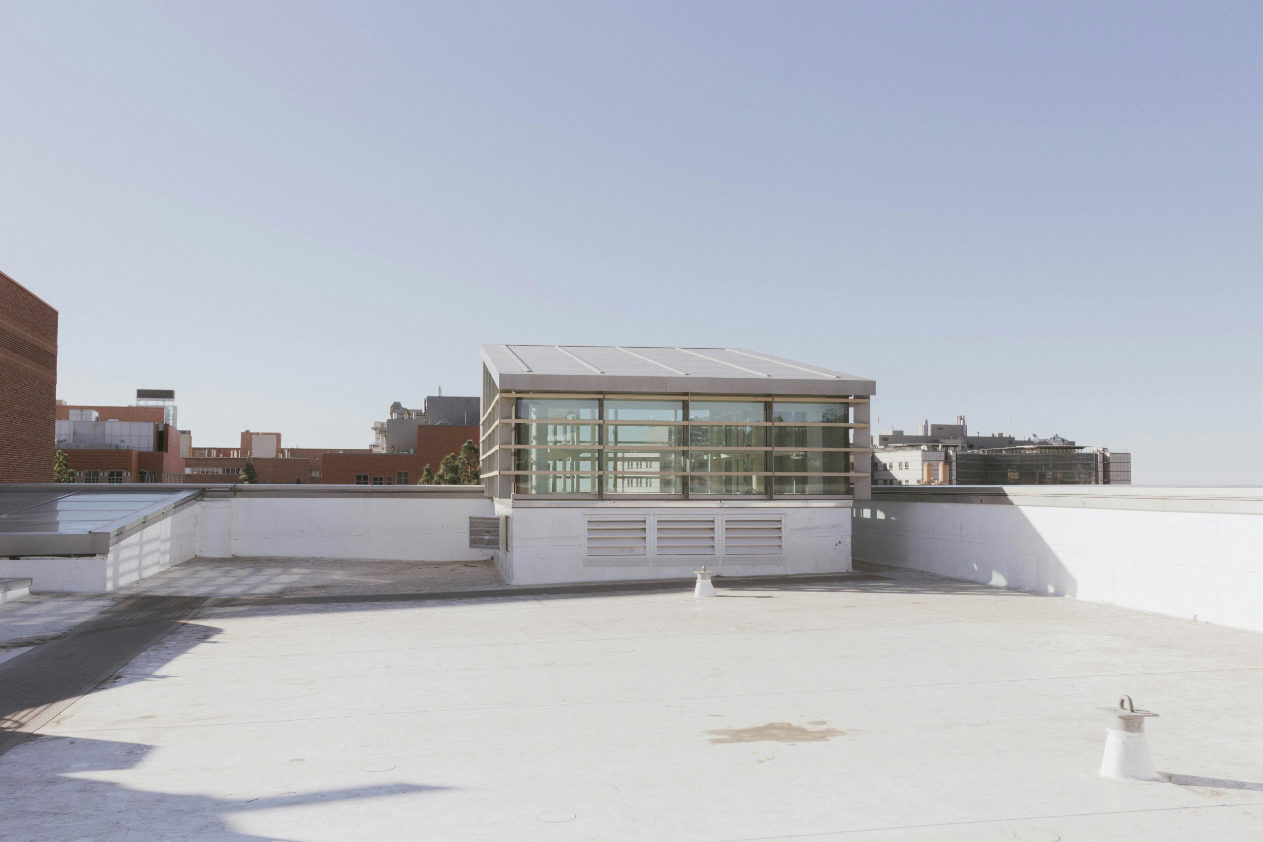 the roof of a building with a building in the background