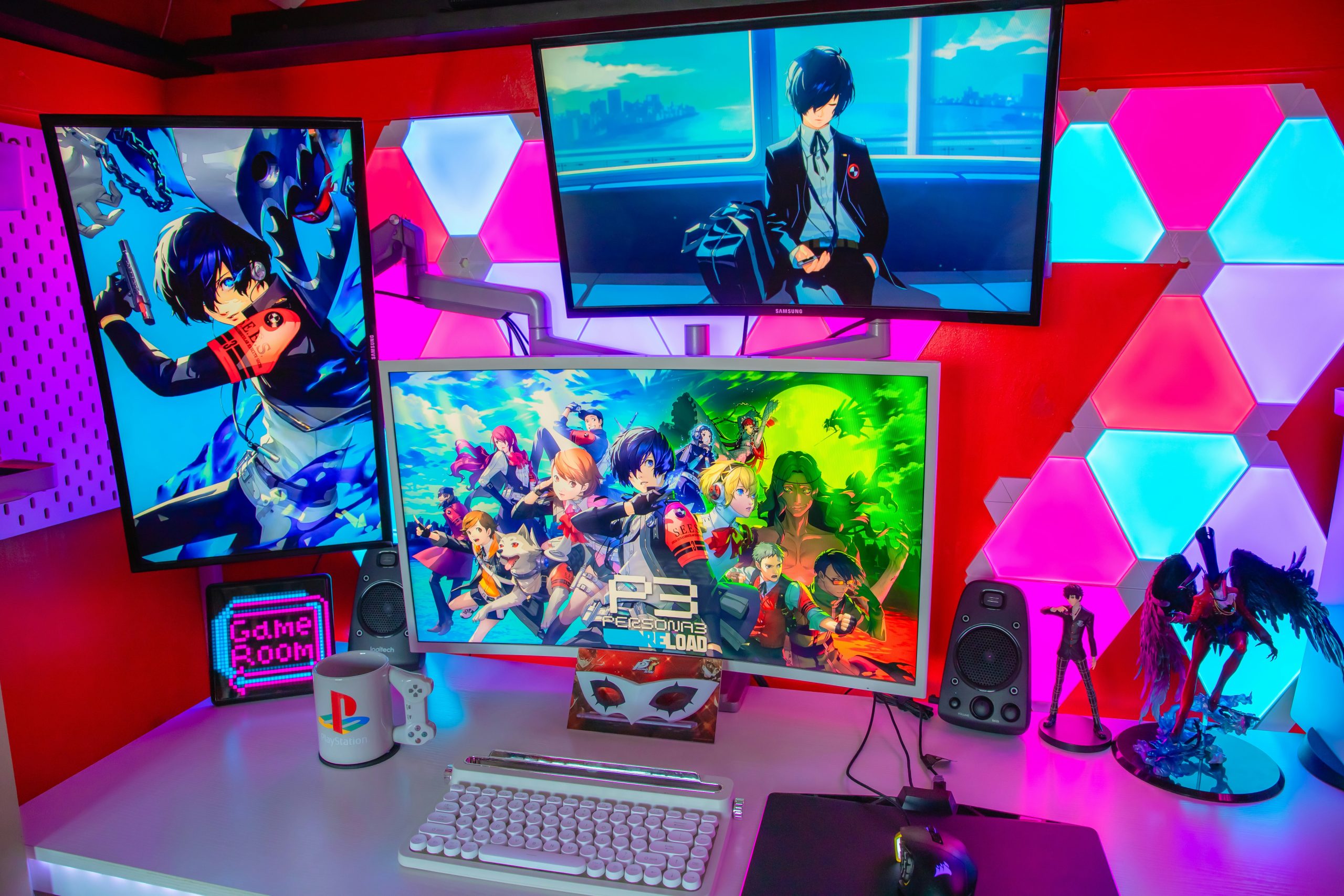 a desk topped with three computer monitors and a keyboard
