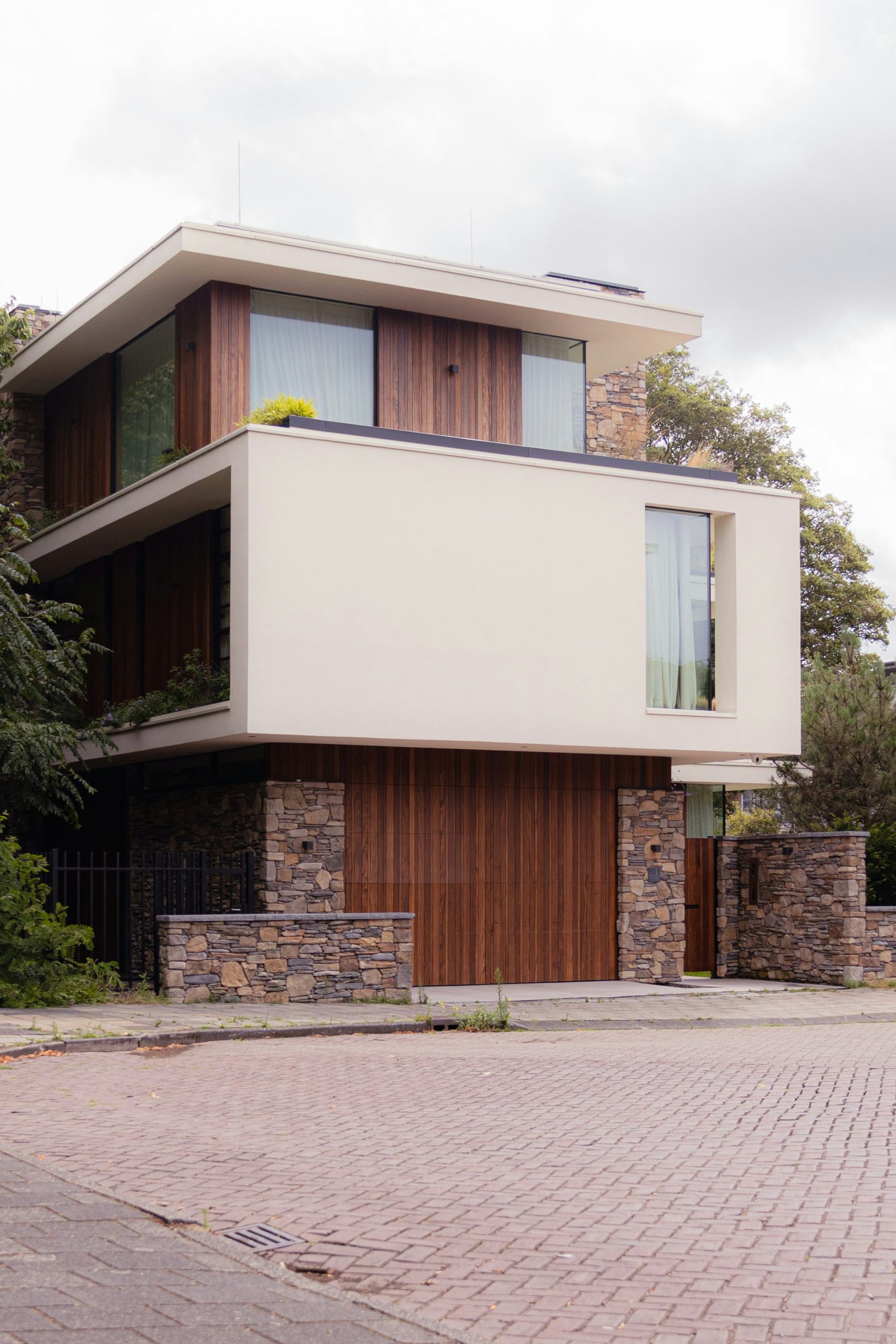 a large white building with wooden doors and windows