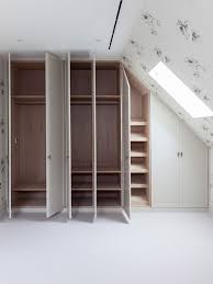 Bespoke fitted bedroom furniture with a sloped ceiling in Wimbledon | Bespoke By Acorn