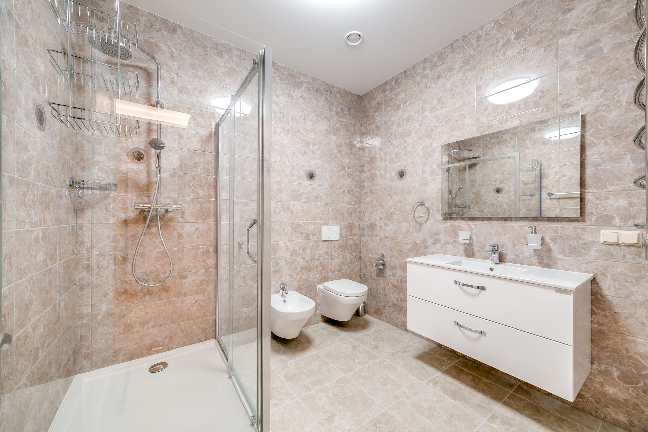 Contemporary bathroom featuring a glass shower and sleek fixtures in a minimalist design.