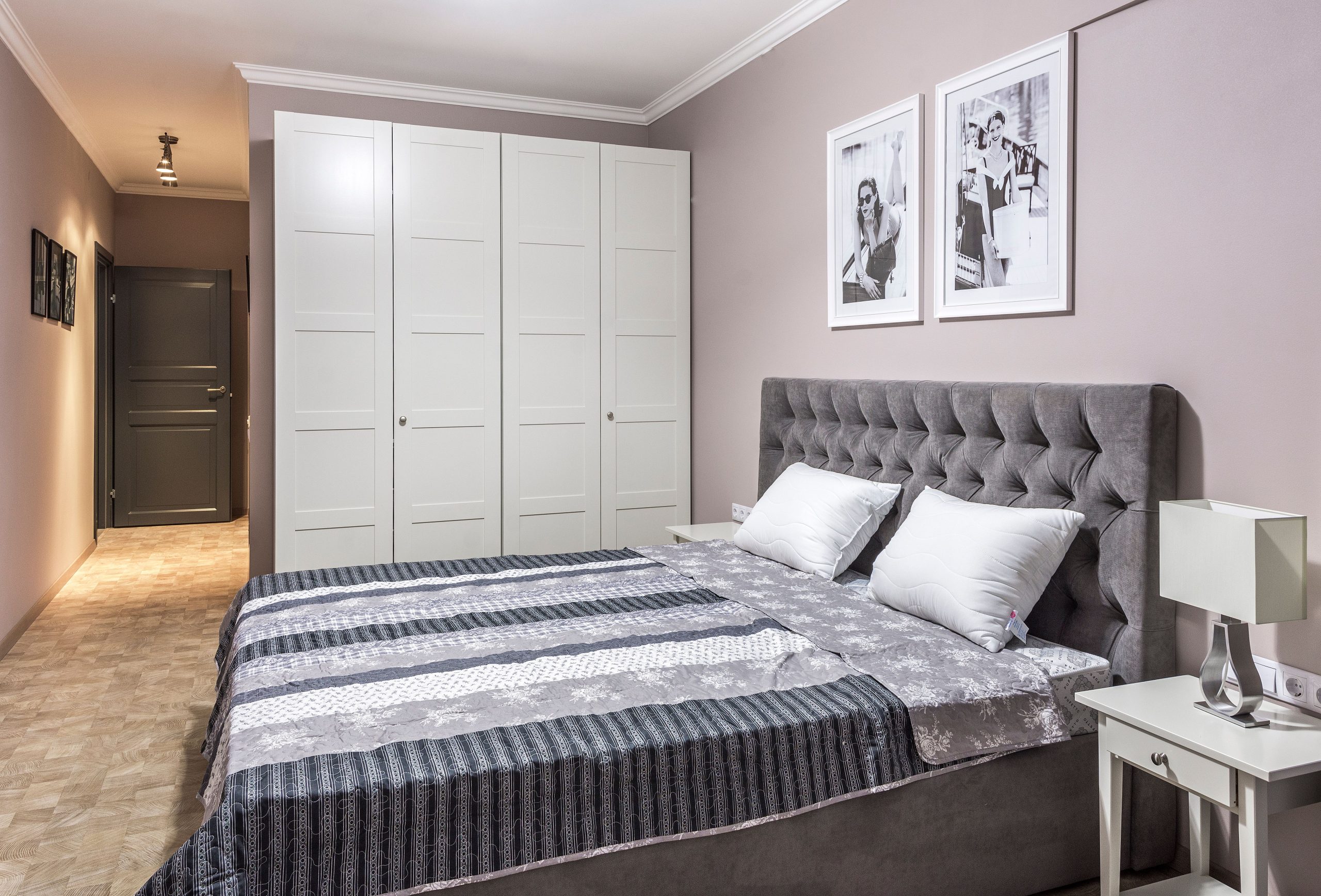 Elegant and cozy bedroom with modern furniture and decor elements.