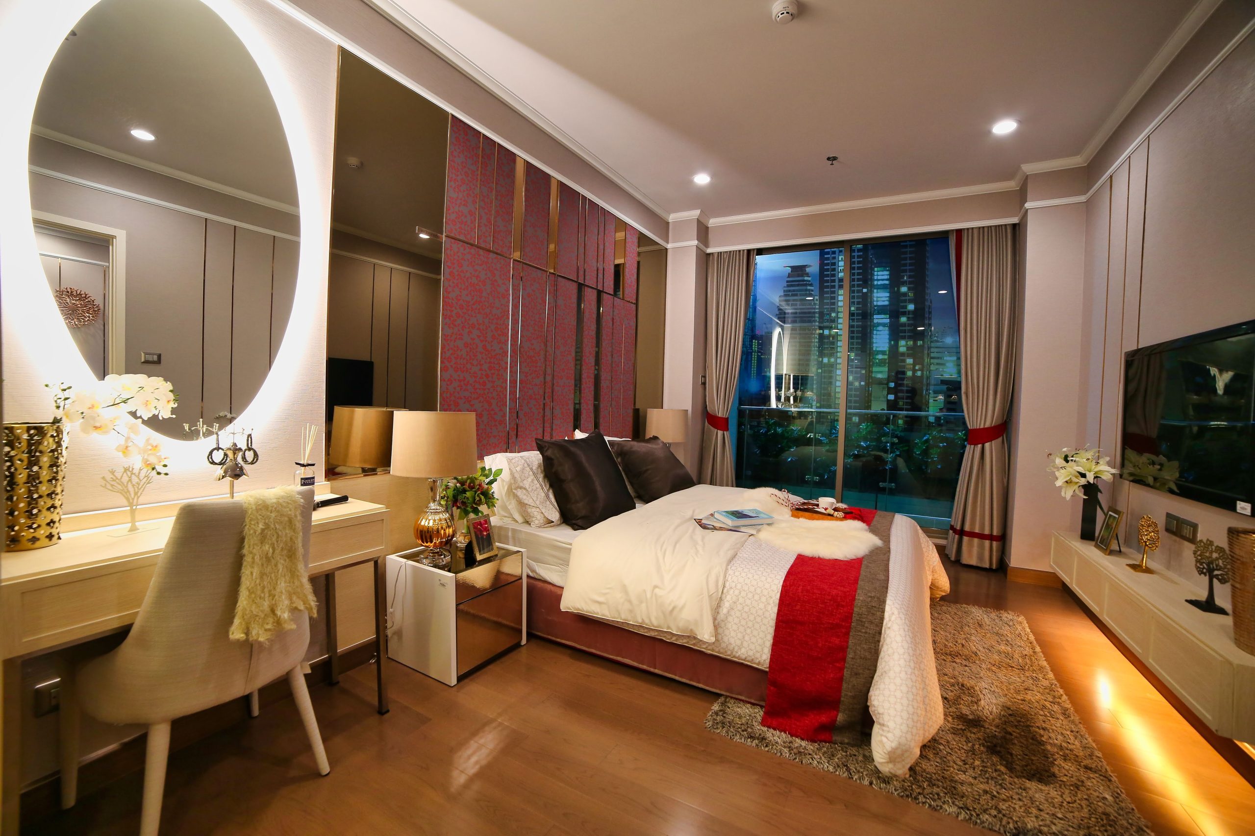 Elegant bedroom interior design featuring a cozy bed and city skyline view.