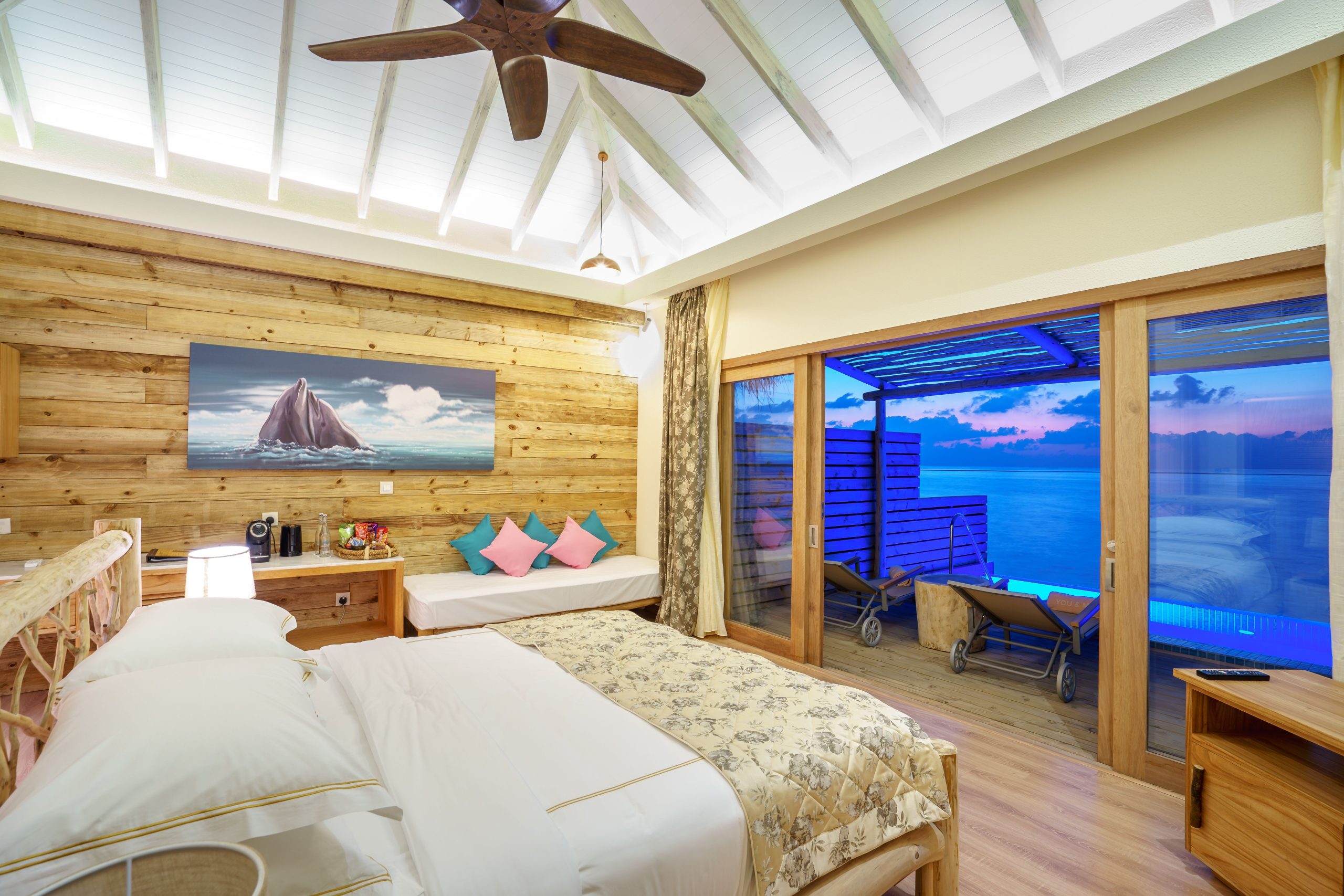 Elegant bedroom with ocean view terrace, ideal for relaxation.