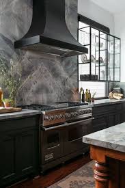 Moody, Glamorous Kitchen With Book-Matched Stone and Warm, Rich Wood | HGTV